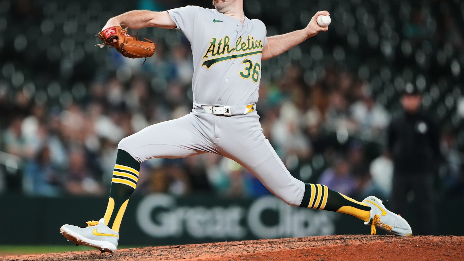 Butler's clutch hit, A's strikeout barrage sink Mariners 7-4