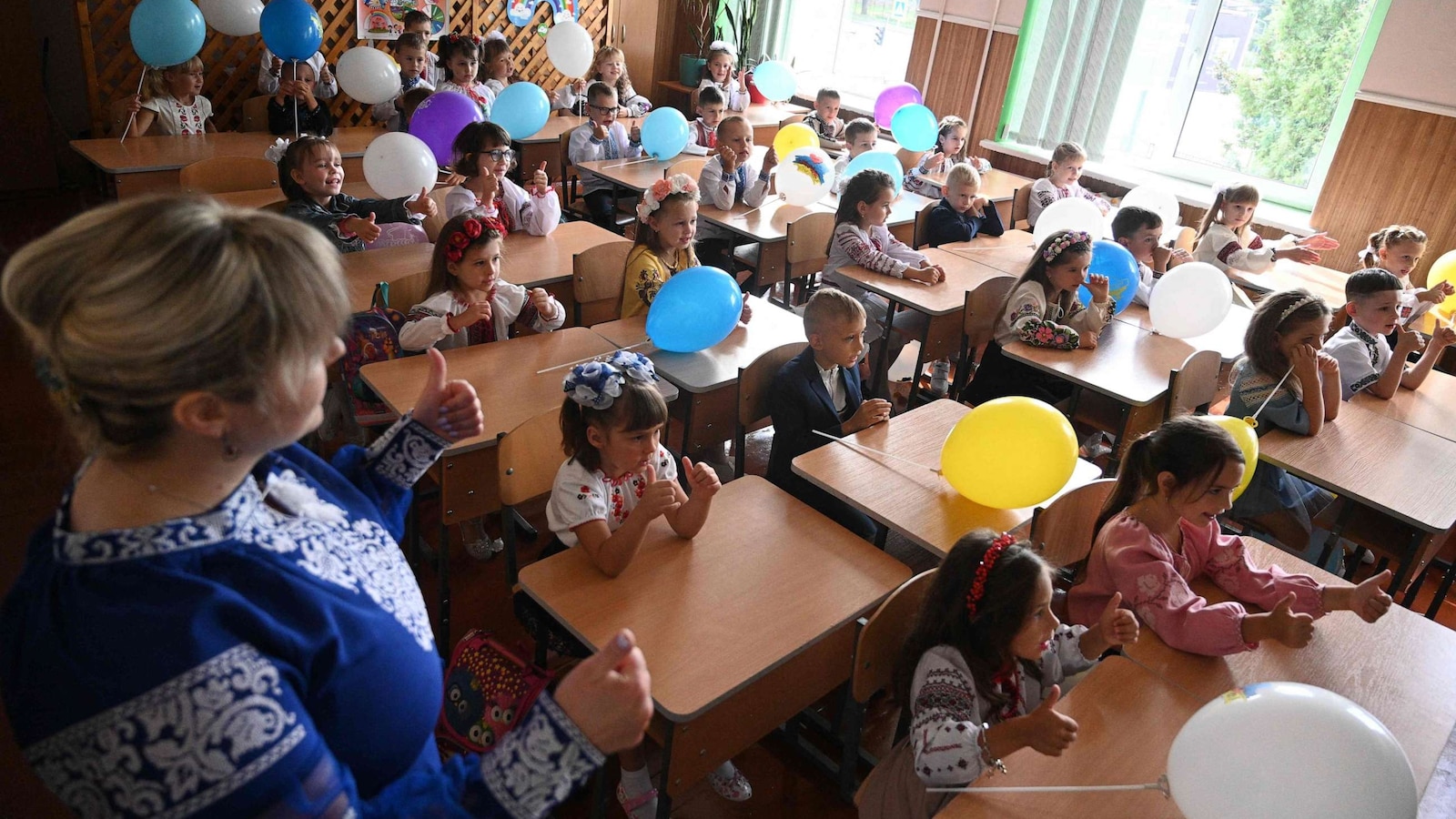 Pupils of the first grade attend the first lesson of the new school year in the western Ukrainian city of Lviv on Sept. 1, 2023.