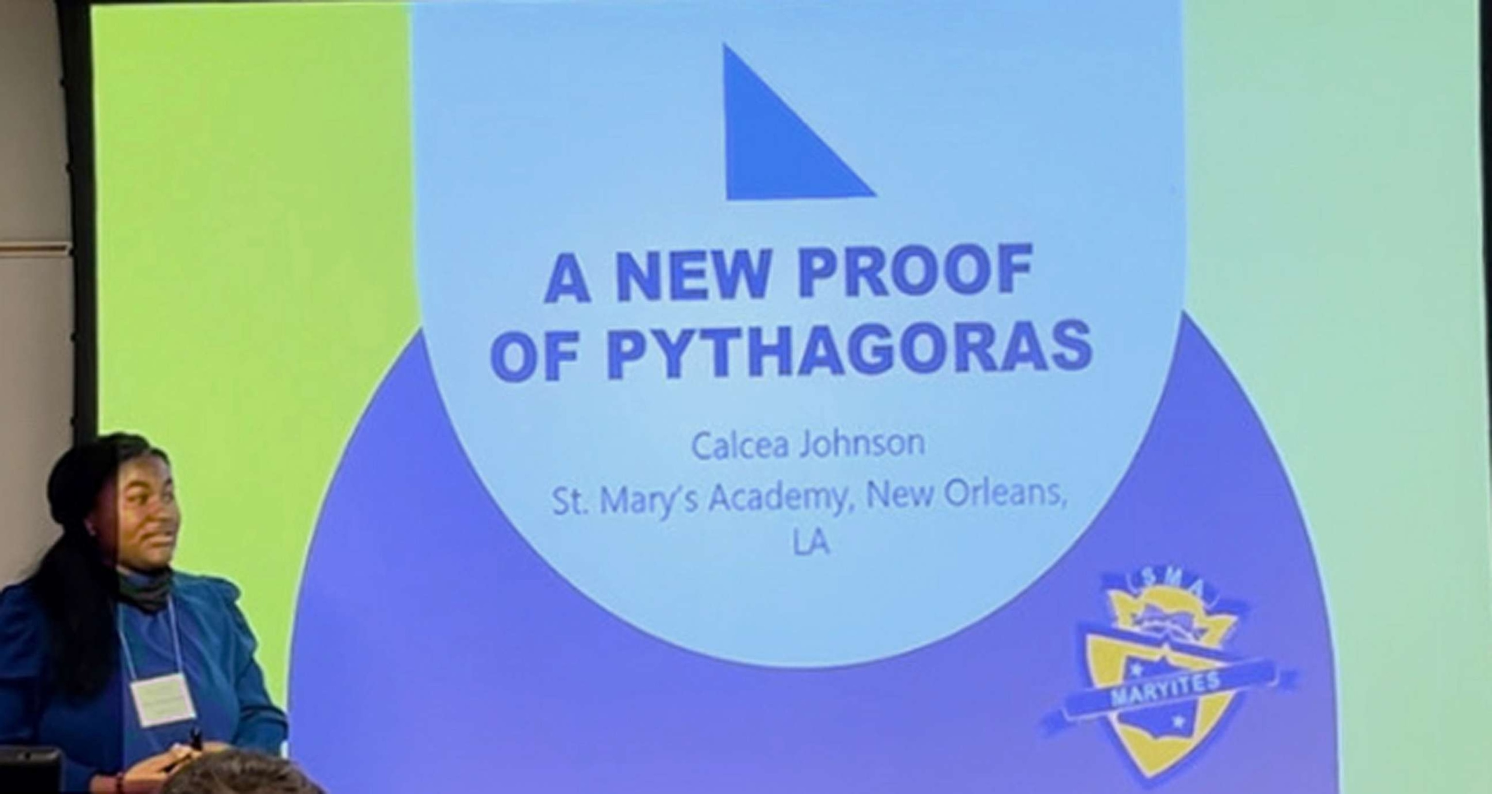 PHOTO: Calcea Johnson shares her and Ne'Kiya Jackson's present their claim to have proven the Pythagorean Theorem through trigonometry at the American Mathematical Society's Annual Southeastern Conference.