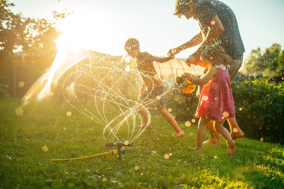 PHOTO: A father plays with children running through a in an undated stock photo.