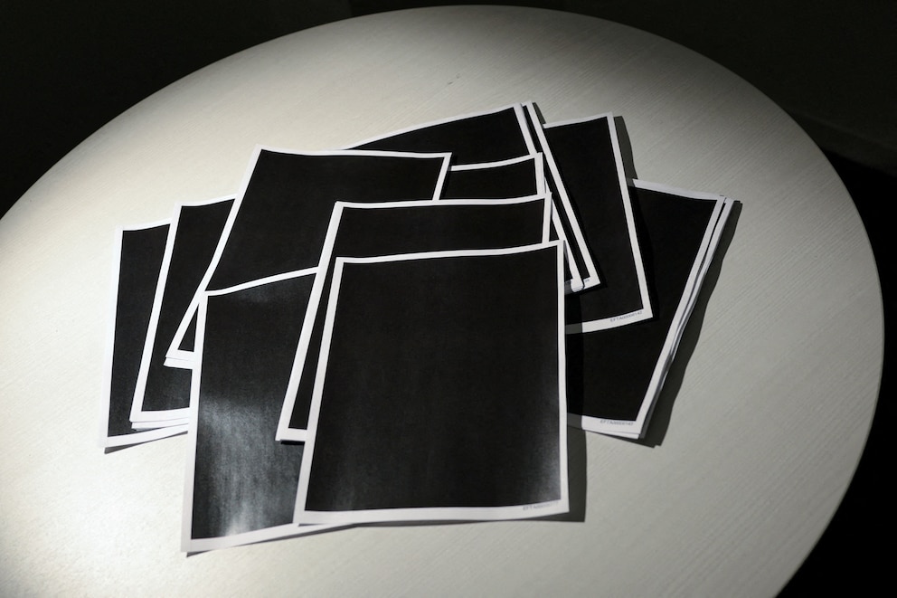 PHOTO: Newly-released documents from disgraced late financier and sex offender Jeffrey Epstein, including a sheaf of entirely redacted pages, are seen in a photograph by Reuters in Washington, D.C., Dec. 19, 2025.