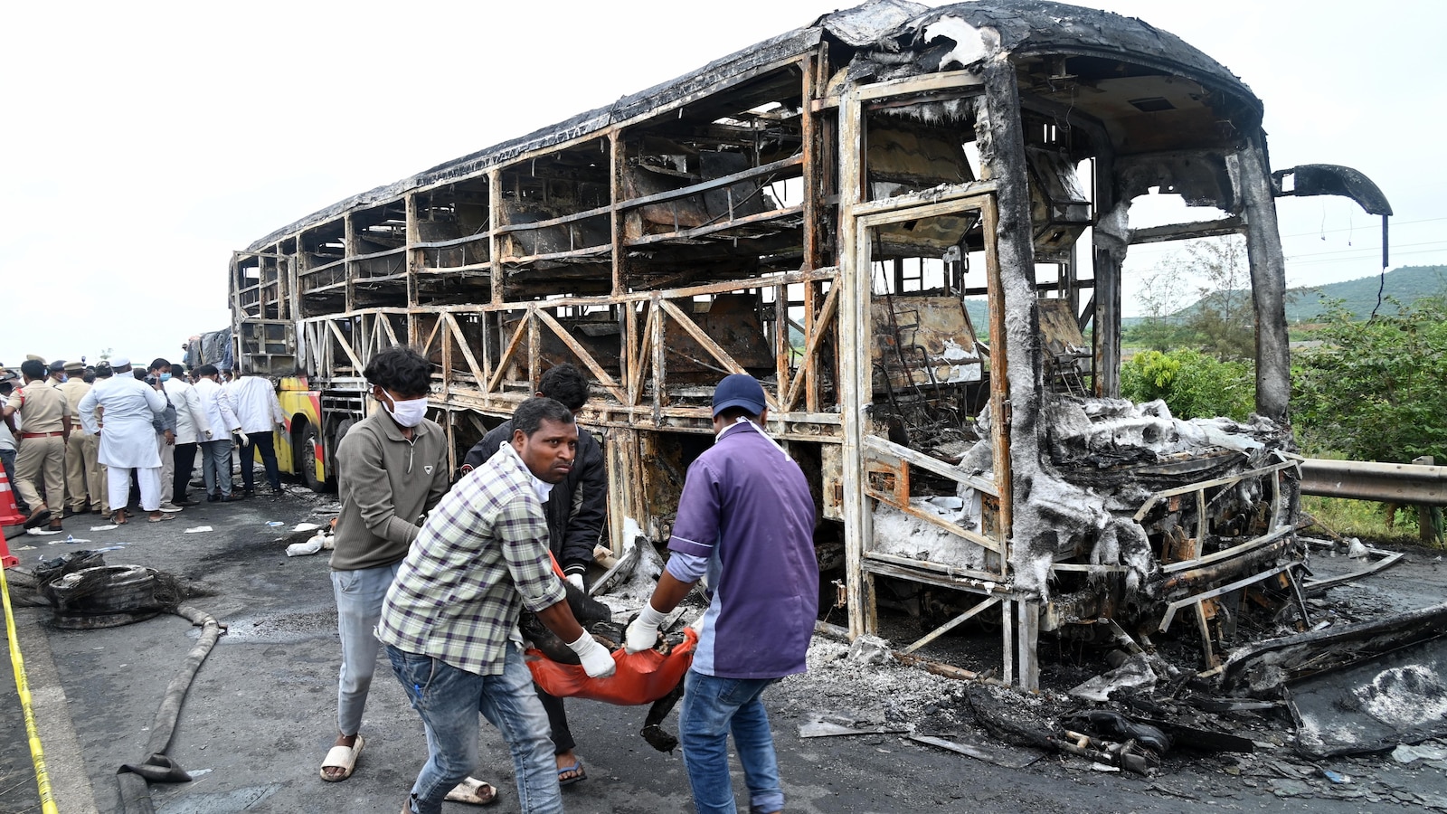 Bus catches fire after being hit by a motorcycle in southern India, killing at least 25