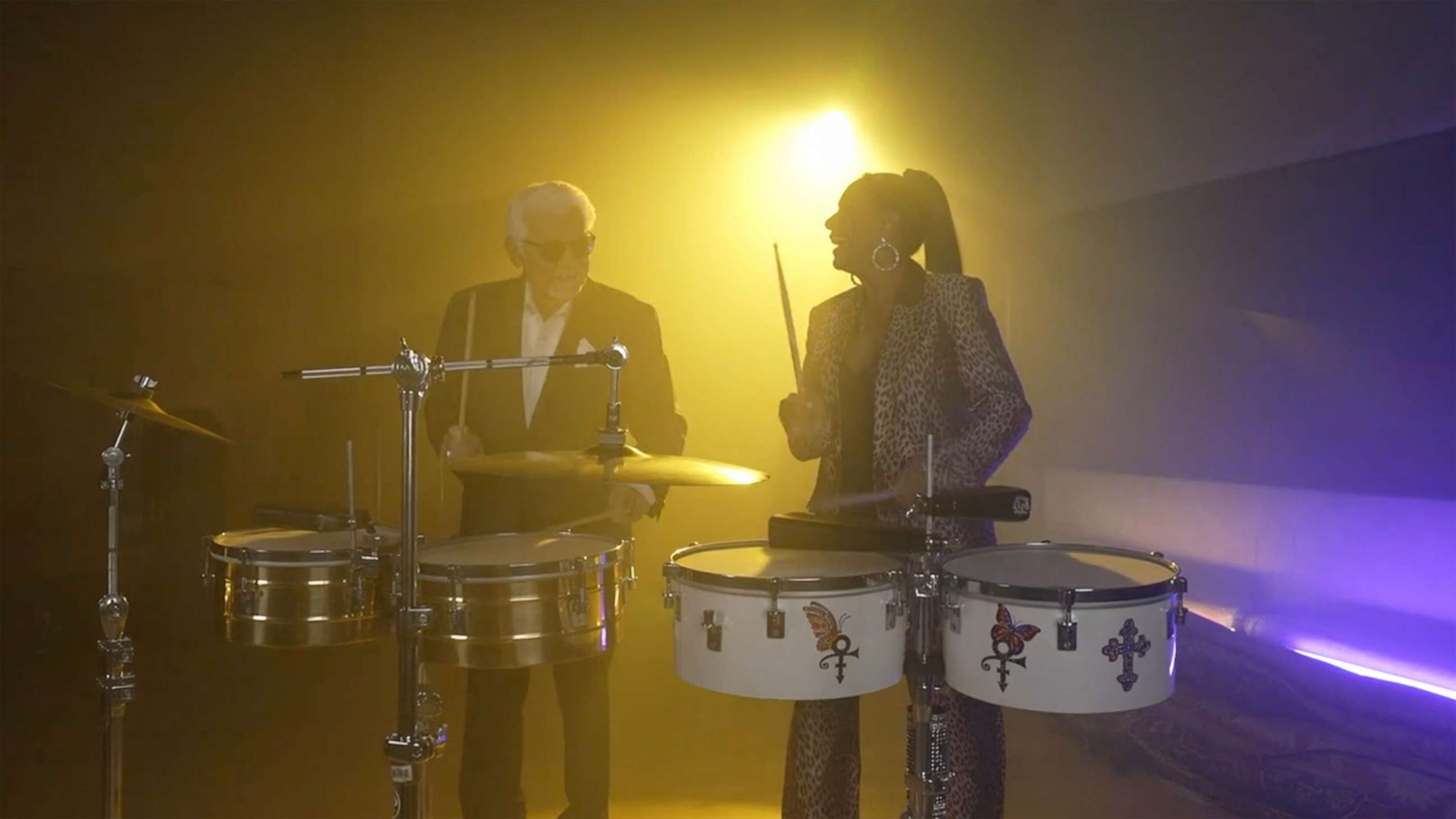 PHOTO: Percussionist and singer Sheila E. plays the drums alongside her father, percussionist Pete Escovedo.