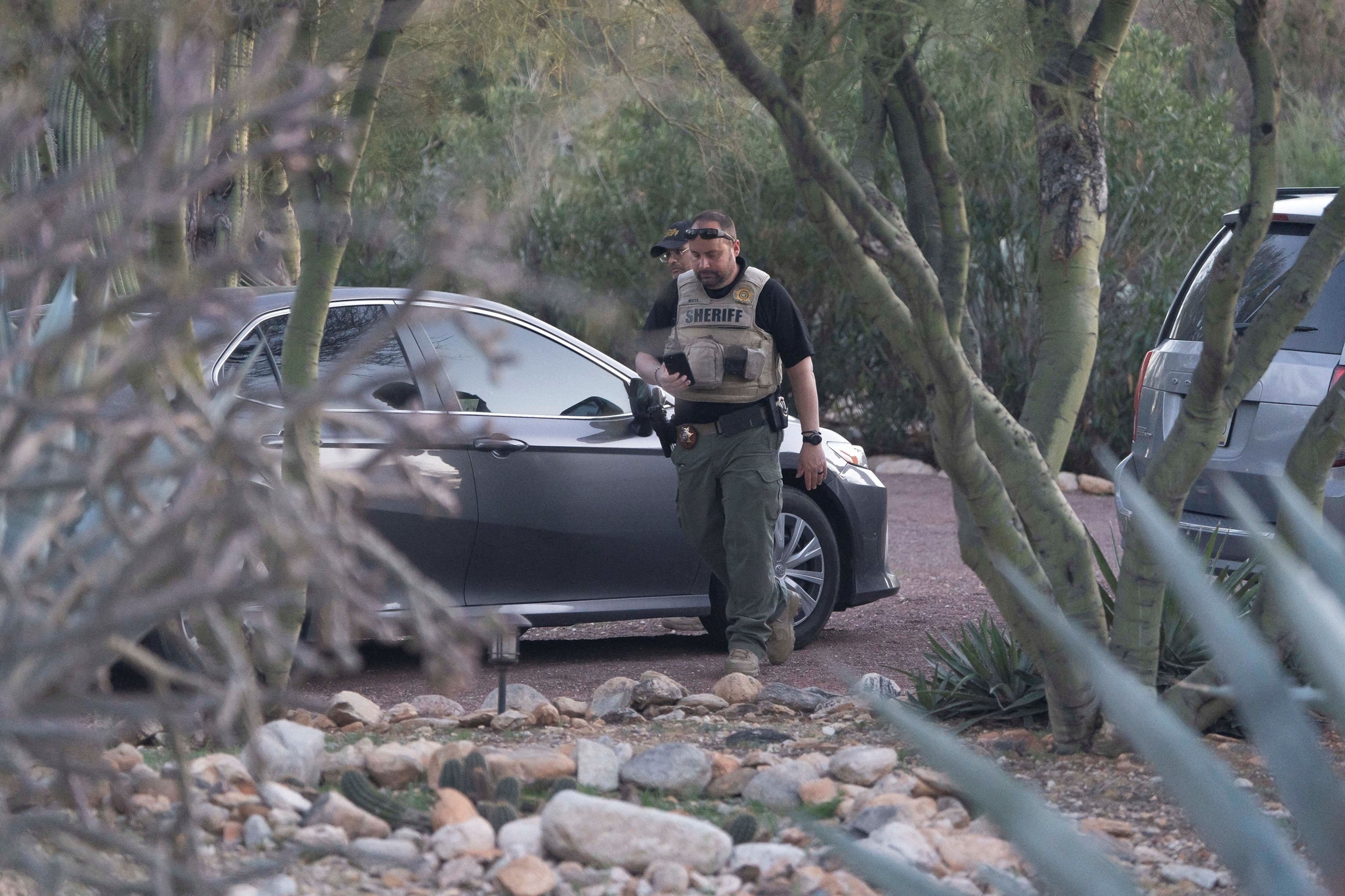 Photo: People attend a vigil after the disappearance of Nancy Guthrie in Tucson