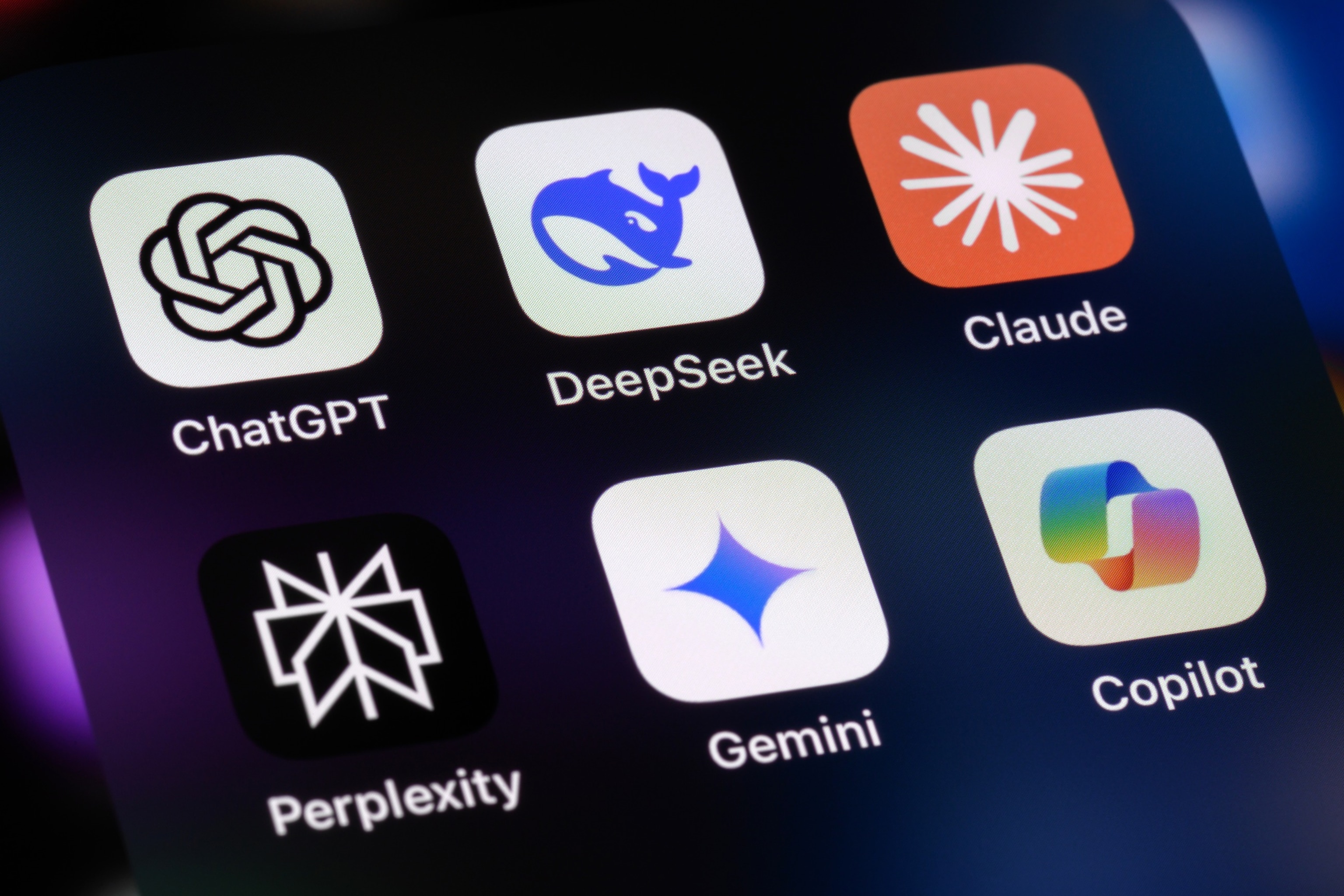 A collection of AI assistant app icons displayed on a smartphone screen.