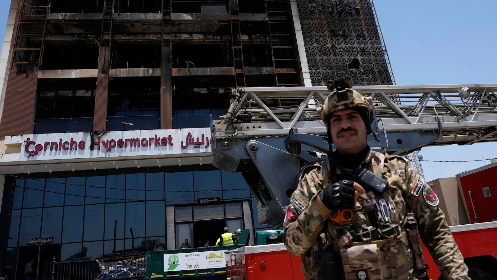 Officials try to identify 18 bodies in deadly Iraq shopping mall fire