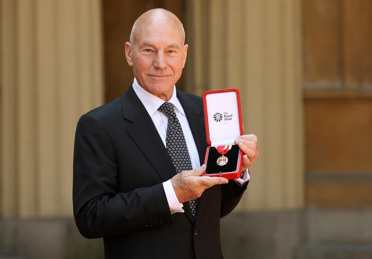 Actor Sir Patrick Stewart poses with his award after he was Knighted by Britain's Queen Elizabeth II at Buckingham Palace, June 2, 2010, in London. Dominic Lipinski /WPA, Pool via Getty Images