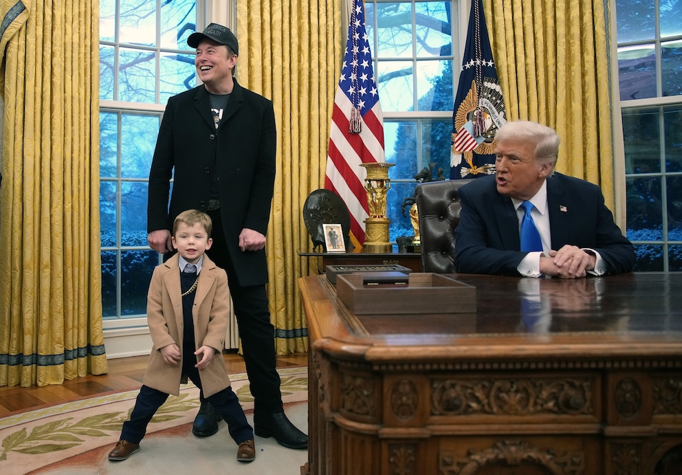 PHOTO: President Donald Trump is  joined by Elon Musk and his son X Æ A-Xii, as he signs a series of executive orders in the Oval Office at the White House on Feb. 11, 2025 in Washington.