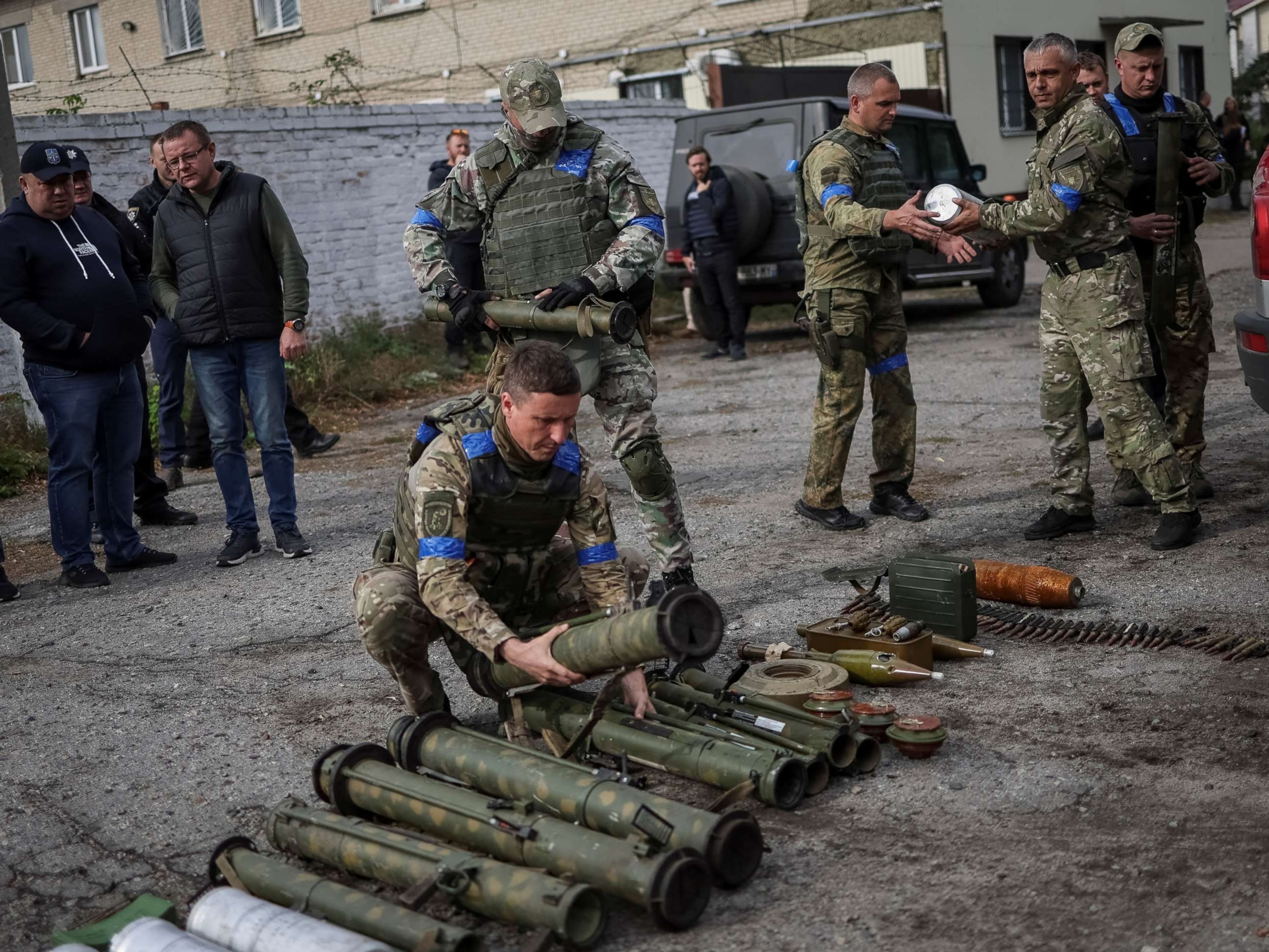 PHOTO: A police sapper sorts unexploded mine shells and weapons after return from the village of Udy, recently liberated by Ukrainian Armed Forces, in the town of Zolochiv, Kharkiv region, Ukraine, Sept. 12, 2022. 