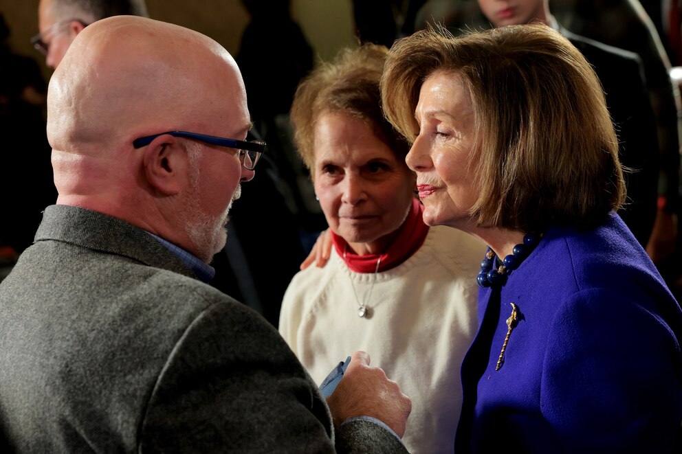 PHOTO: Rep. Nancy Pelosi hugs Gladys and Ken Sicknick, the mother and brother of deceased Capitol Police Officer Brian Sicknick, at a hearing to mark the fifth anniversary of the January 6, 2021 attack, Jan. 6, 2026 in Washington.