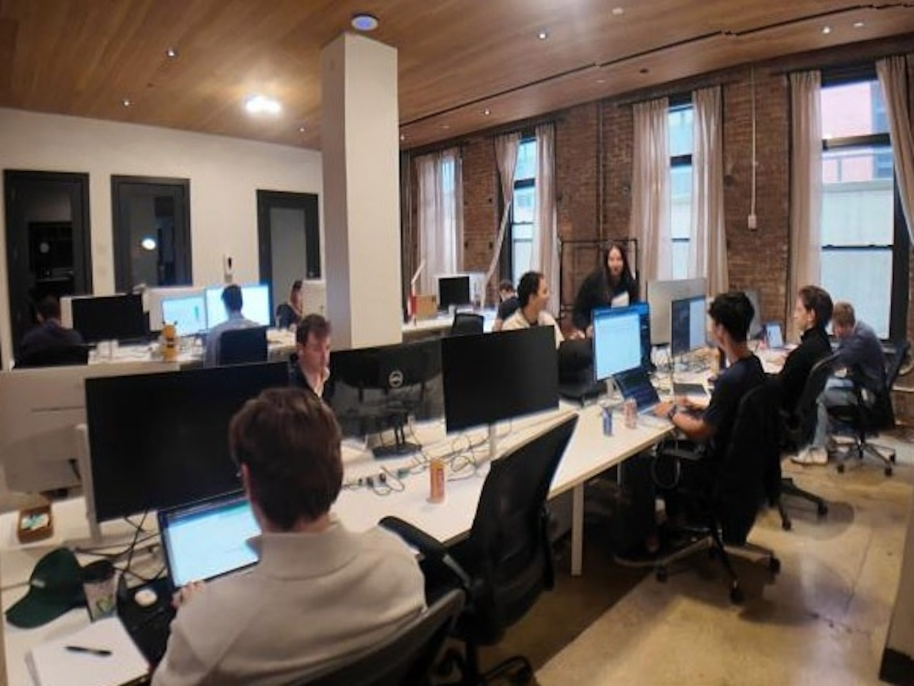 PHOTO: Staffers in Kalshi's integrity monitoring office are seen working in the firm's New York office.