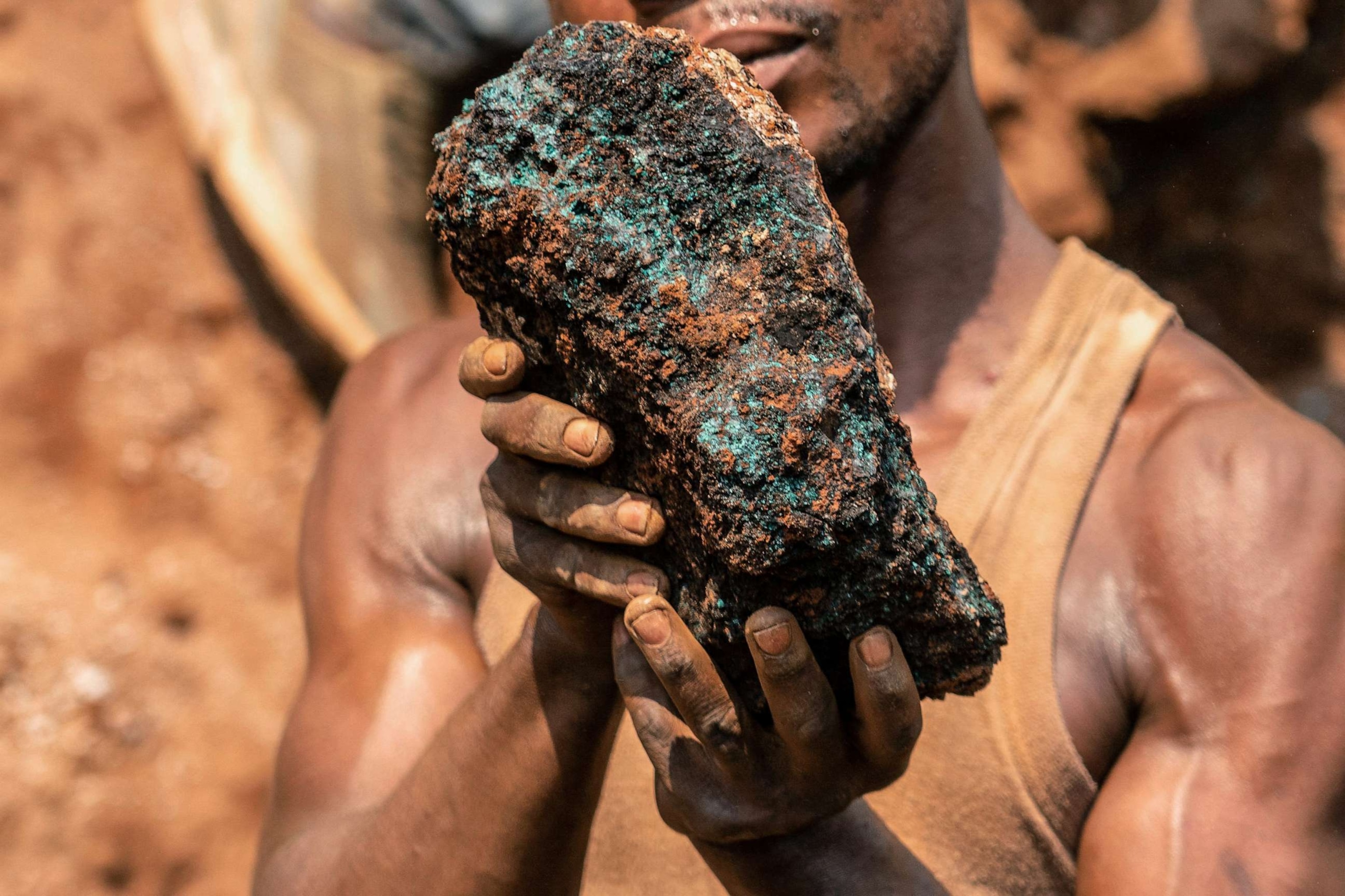 PHOTO: Dela wa Monga, an artisanal miner, holds a cobalt stone at the Shabara artisanal mine near Kolwezi, Democratic Republic of Congo, Oct. 12, 2022.