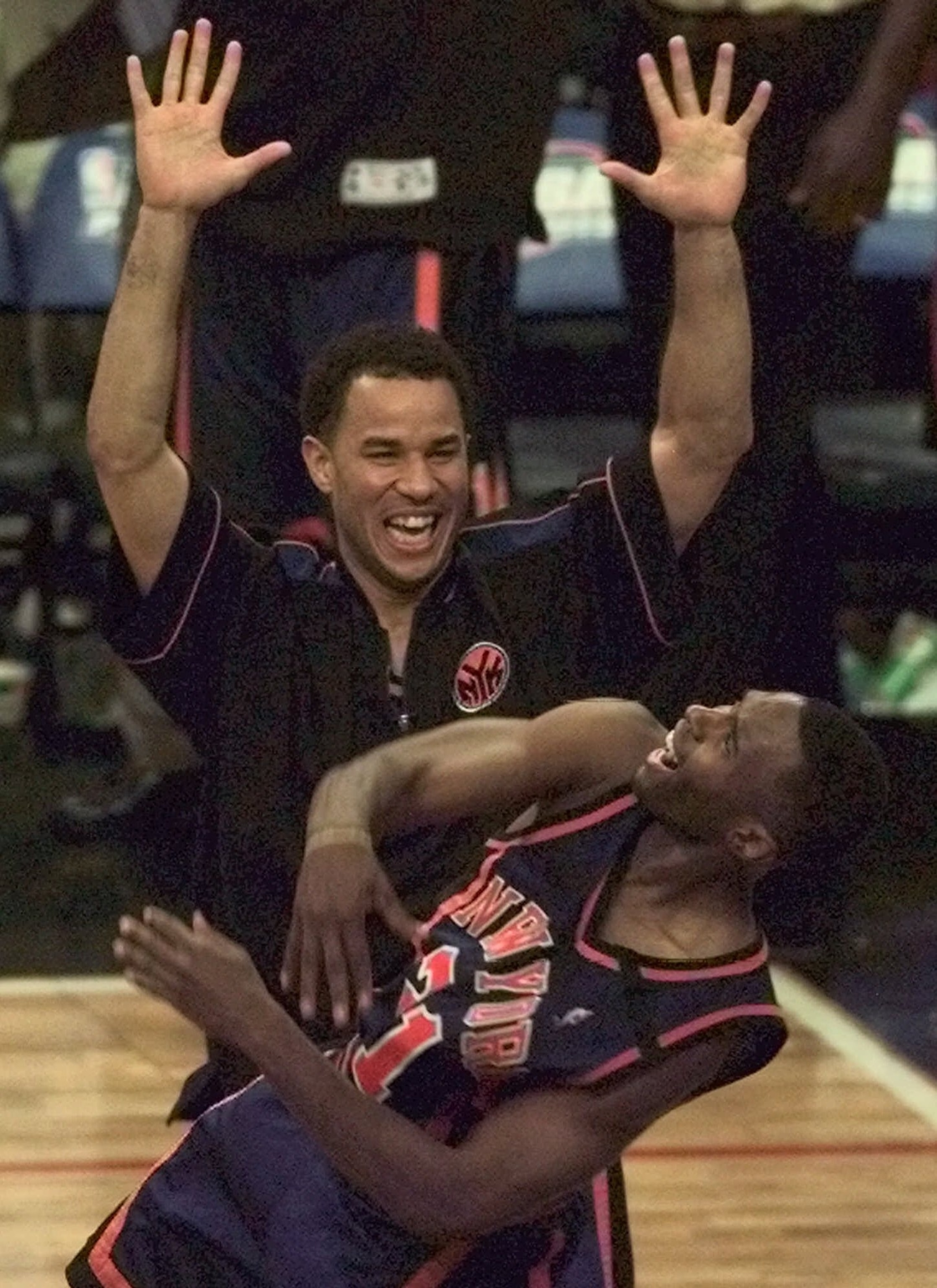 PHOTO: New York Knicks guards Charlie Ward, foreground, and Rick Brunson celebrate after beating the Miami Heat, 78-77, in game five in the first round of the  Eastern Conference playoffs in Miami Sunday, May 16, 1999. 