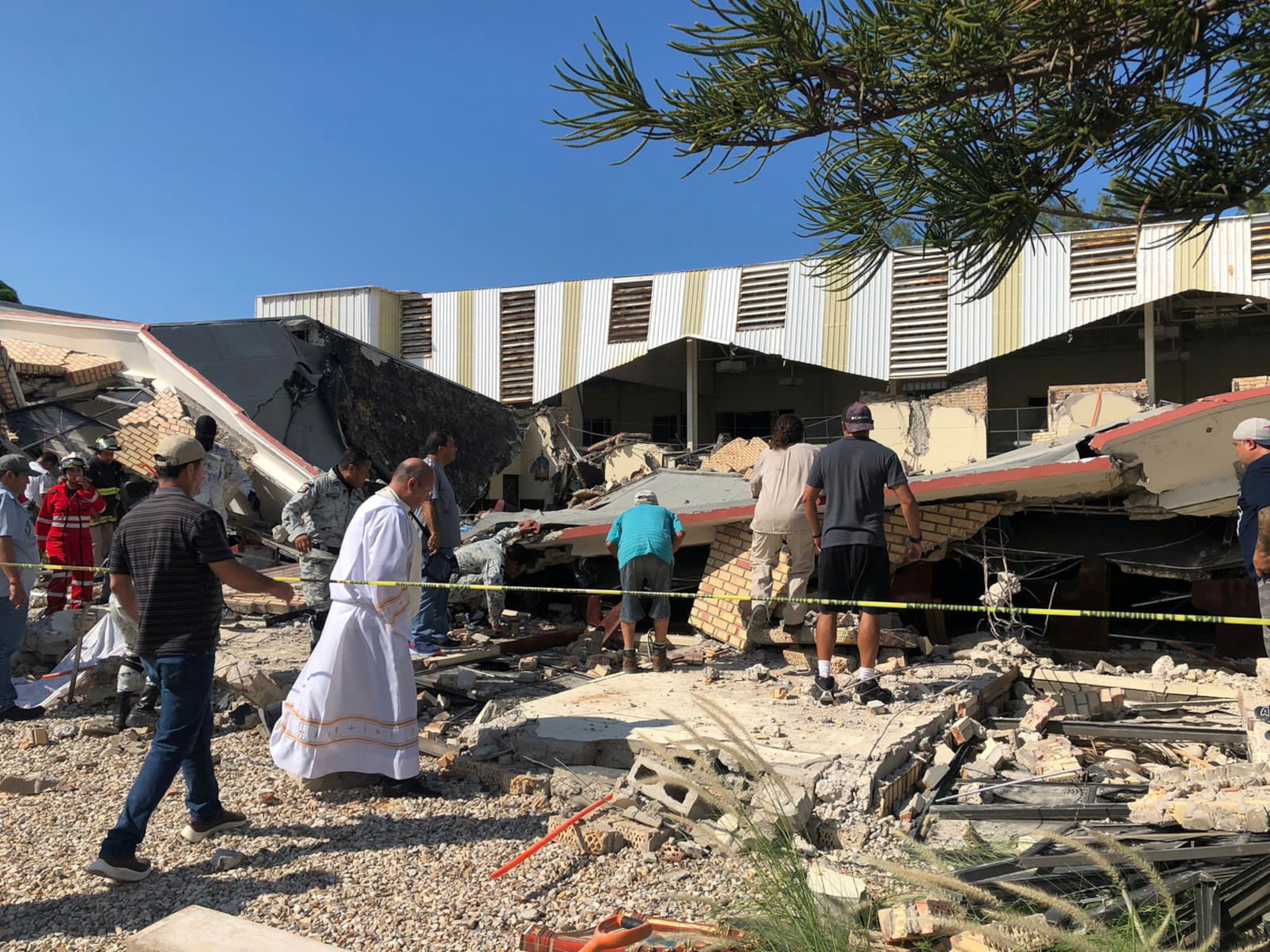 PHOTO: Members of security forces, people and a priest work at a site where a church roof collapsed during Sunday mass in Ciudad Madero, in Tamaulipas state, Mexico in this handout picture distributed to Reuters on Oct. 1, 2023.