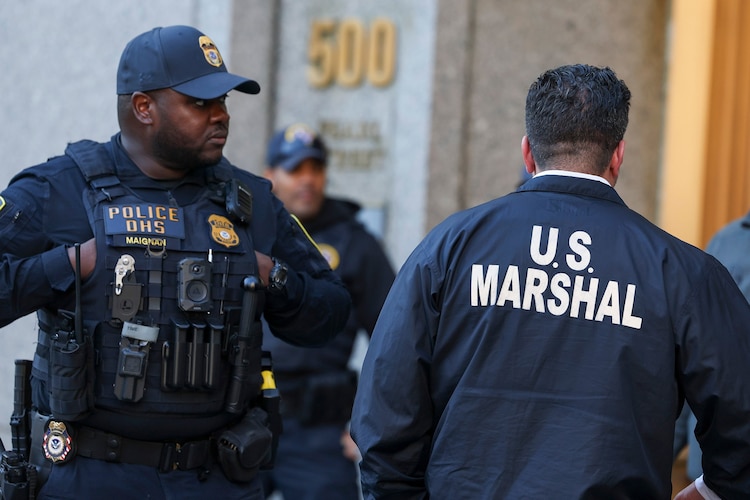 PHOTO: Police officers work outside the courthouse in which former Venezuelan President Nicolas Maduro and his wife Cilia Flores are attending in New York, Oct. 15, 2026.