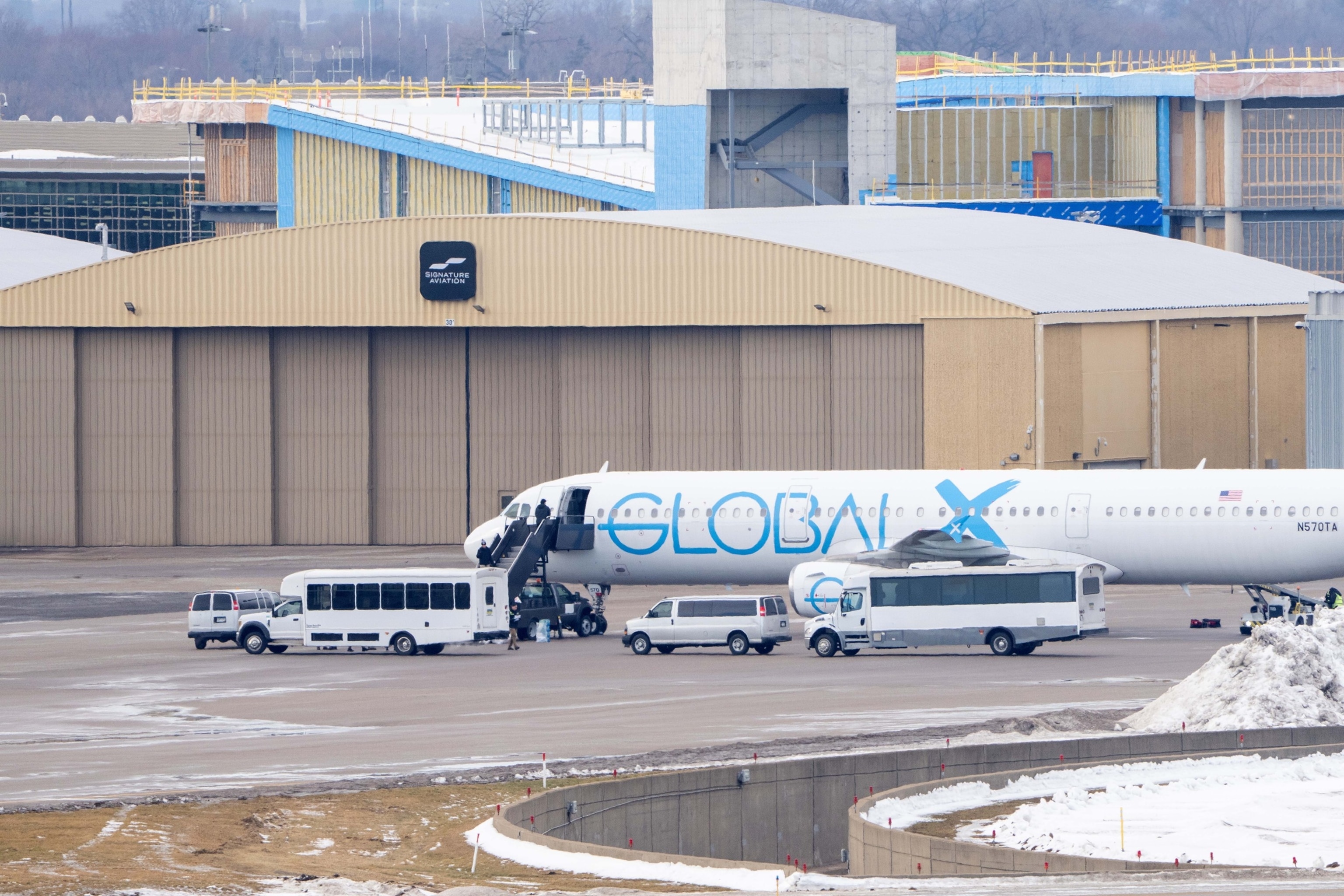 PHOTO: In this Jan. 9, 2026, file photo, a detainee of Immigration and Customs Enforcement (ICE) boards a Global X aircraft at the Minneapolis/St. Paul Airport in Minnesota.
