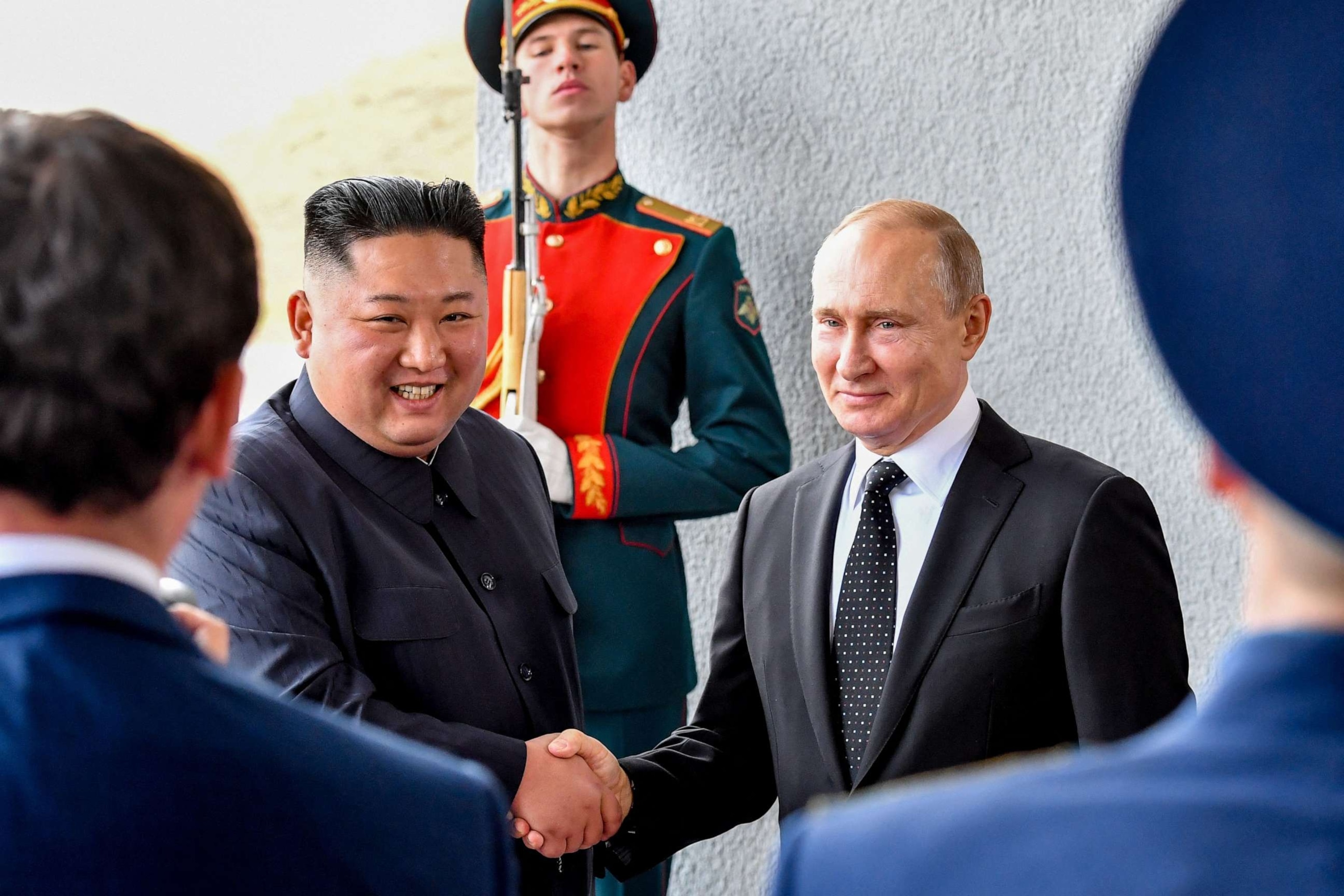 PHOTO: Russian President Vladimir Putin welcomes North Korean leader Kim Jong Un prior to their talks at the Far Eastern Federal University campus on Russky island in the far-eastern Russian port of Vladivostok on April 25, 2019.