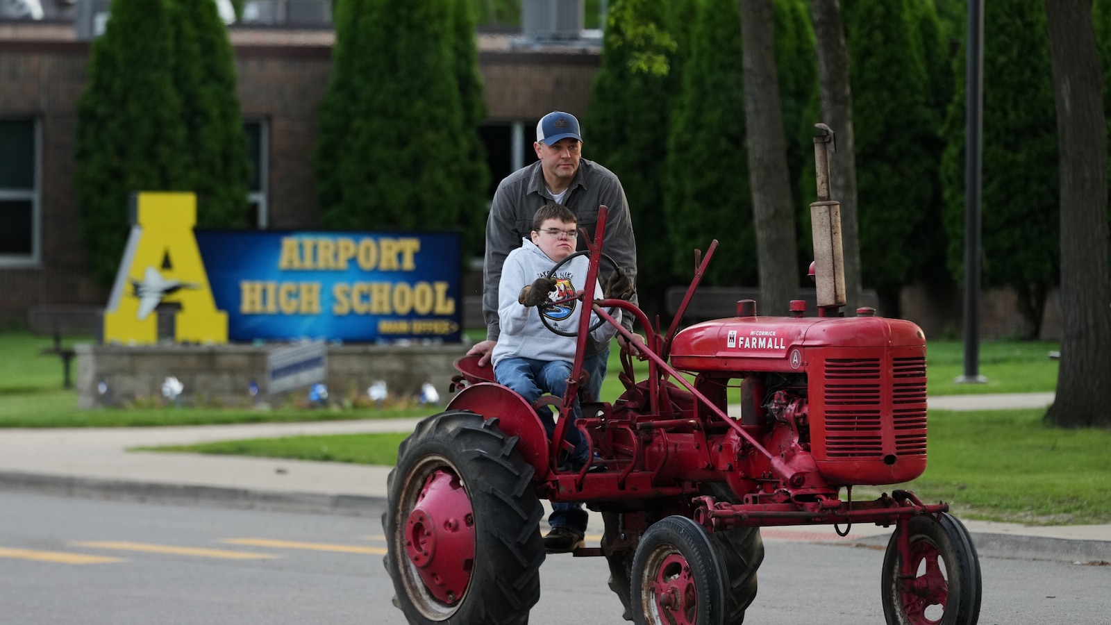  Michigan seniors arrive at school in style on Tractor Day