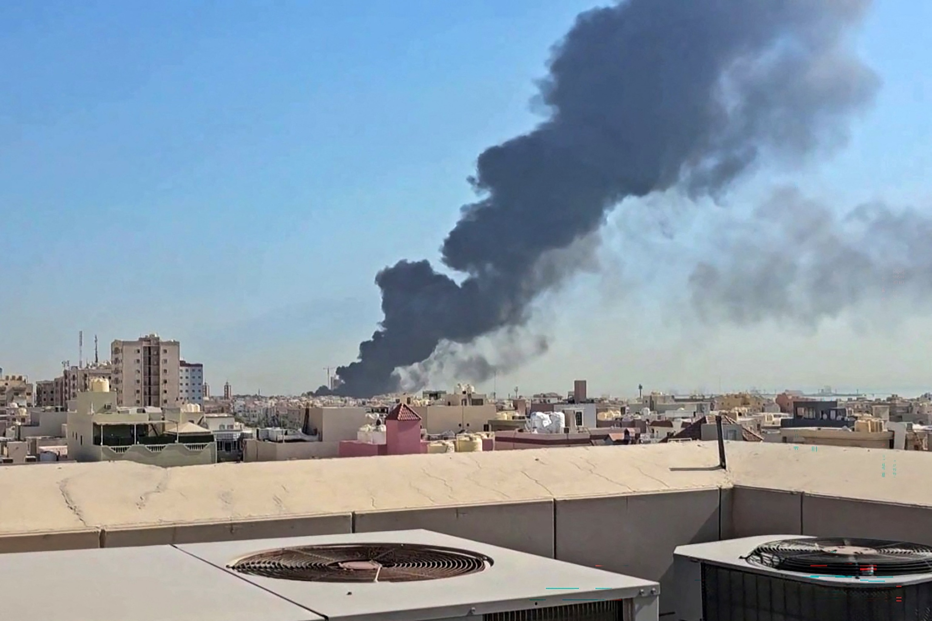 PHOTO: This screen grab taken from UGC video footage posted on social media on July 18, 2026, shows a plume of black smoke billowing over the town of Mangaf, south of Kuwait City.