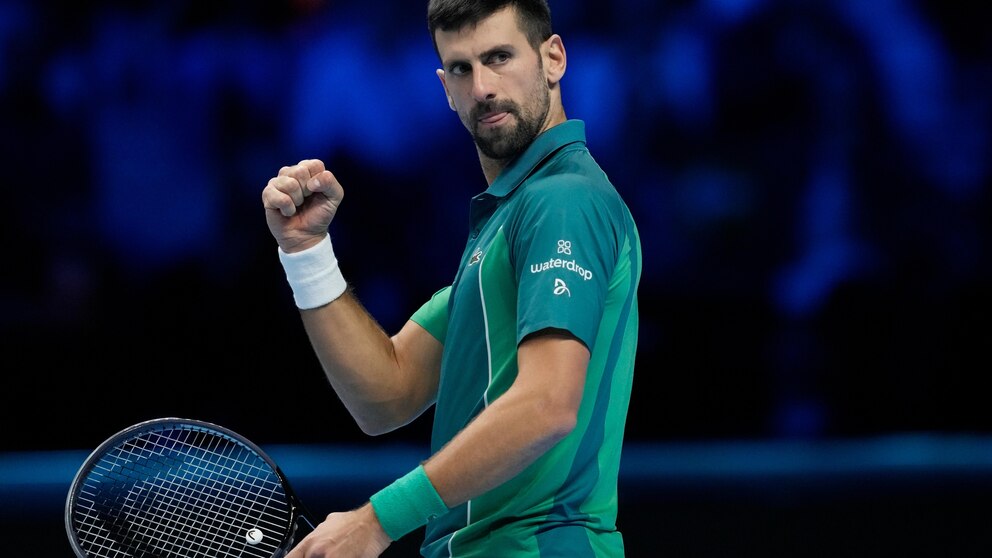 Serbia's Novak Djokovic reacts after winning a point to Italy's Jannik Sinner during their singles final tennis match of the ATP World Tour Finals at the Pala Alpitour, in Turin, Italy, Sunday, Nov. 19, 2023. (AP Photo/Antonio Calanni)