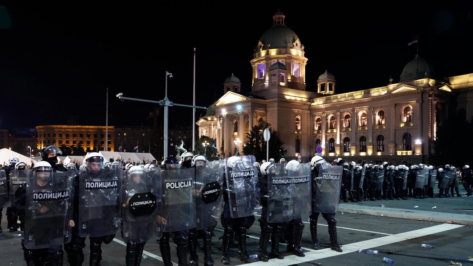 Riot police separate opponents, loyalists of Serbia's president as tensions soar amid protests