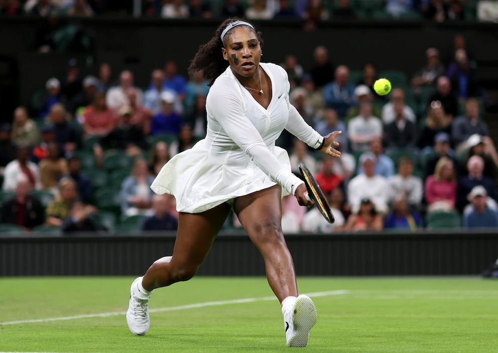 PHOTO: Serena Williams of United States plays a forehand against Harmony Tan of France during their Women's Singles First Round Match on day two of The Championships Wimbledon 2022  in London, England. 