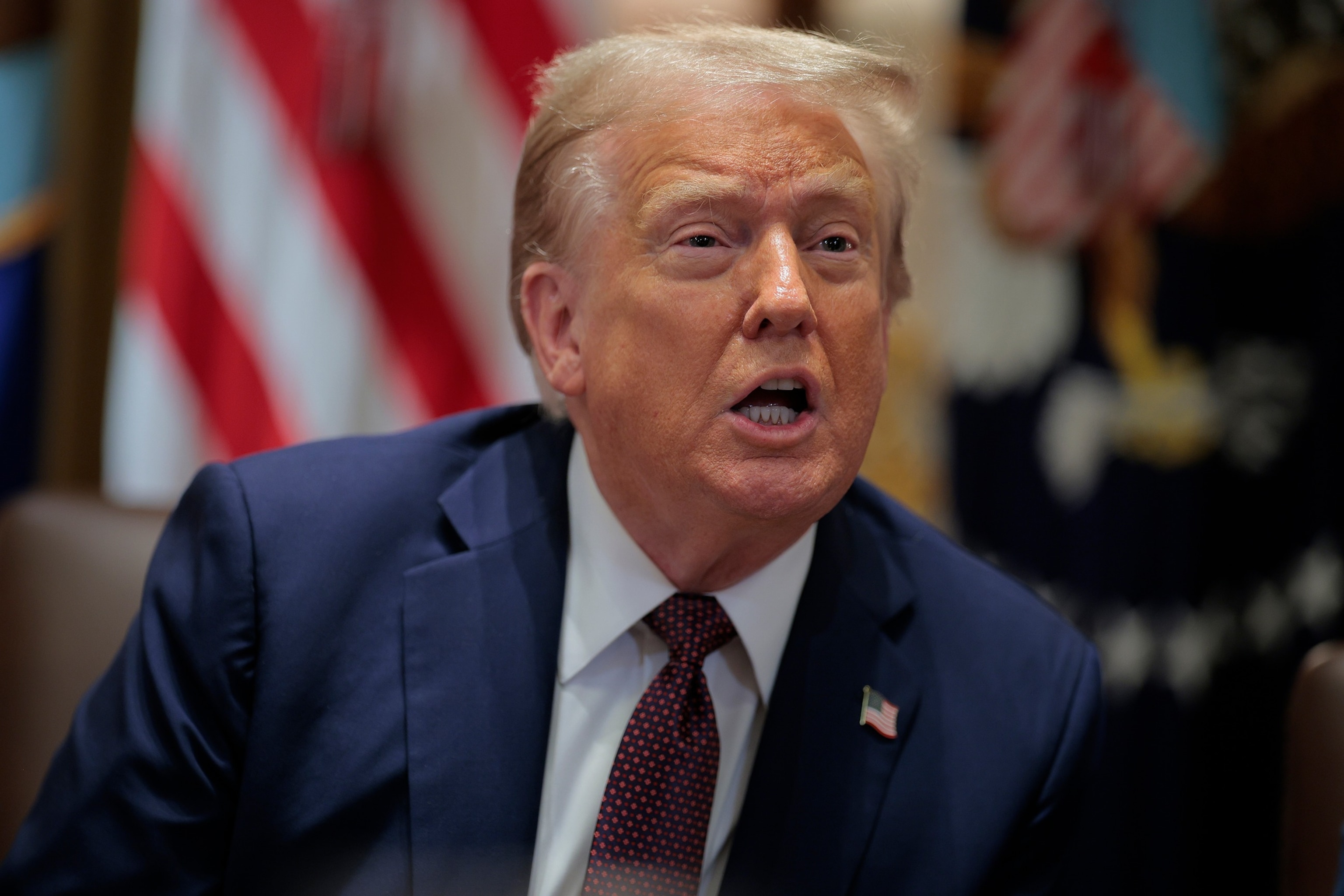 President Donald Trump answers a reporter's question as he chairs a Cabinet meeting in the Cabinet Room of the White House in Washington, August 26, 2025. Chip Somodevilla/Getty Images