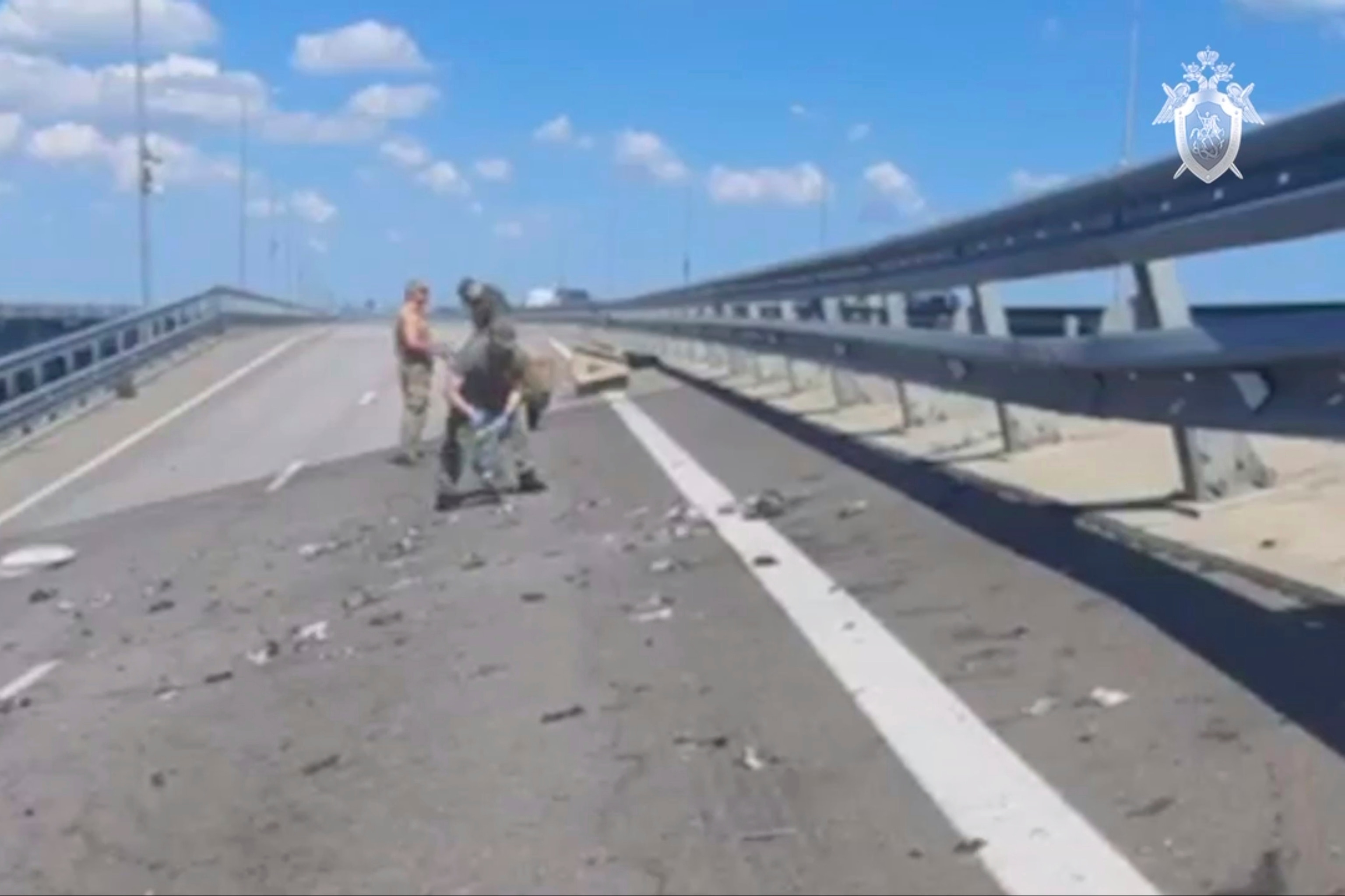 PHOTO:Investigators work at an automobile link of the Crimean Bridge connecting Russian mainland and Crimean peninsula over the Kerch Strait not far from Kerch, Crimea July 17, 2023.