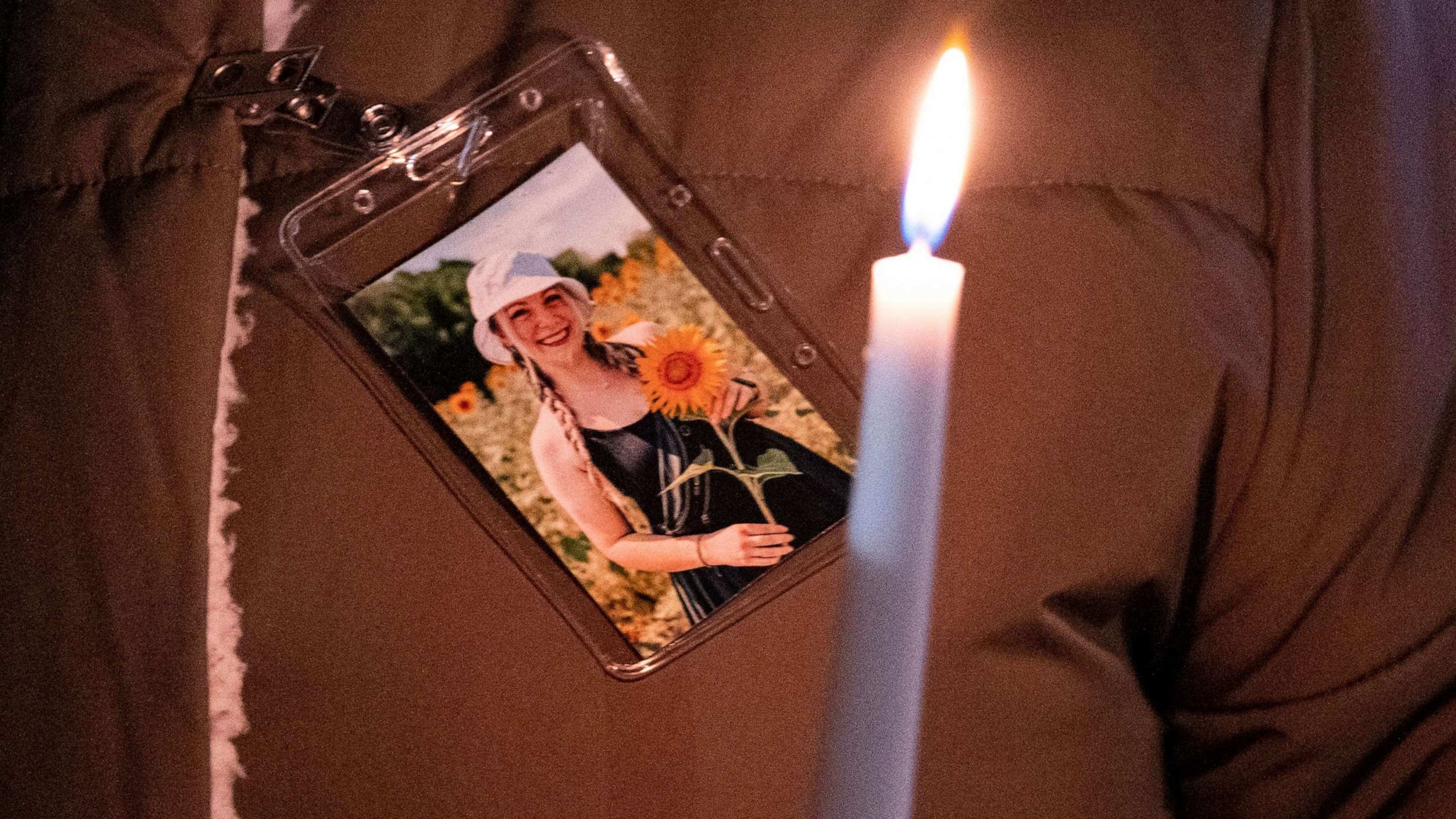 PHOTO: A photo of teacher Abby Zwerner is pinned to a coat during a vigil held for her after she was shot by a 6-year-old student at Richneck Elementary in Newport News, Va.