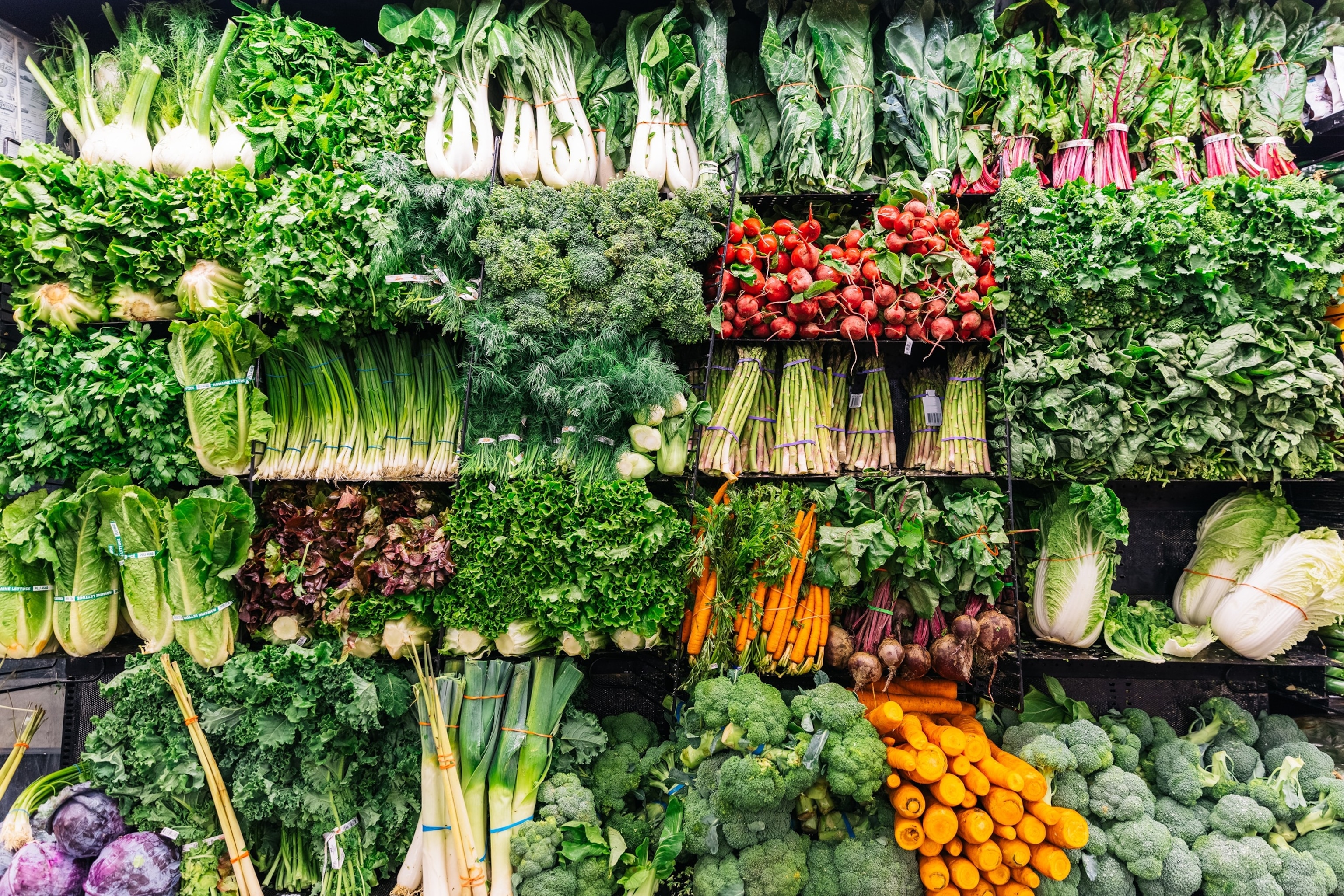 PHOTO: Fresh greens and vegetables on a display in a supermarket