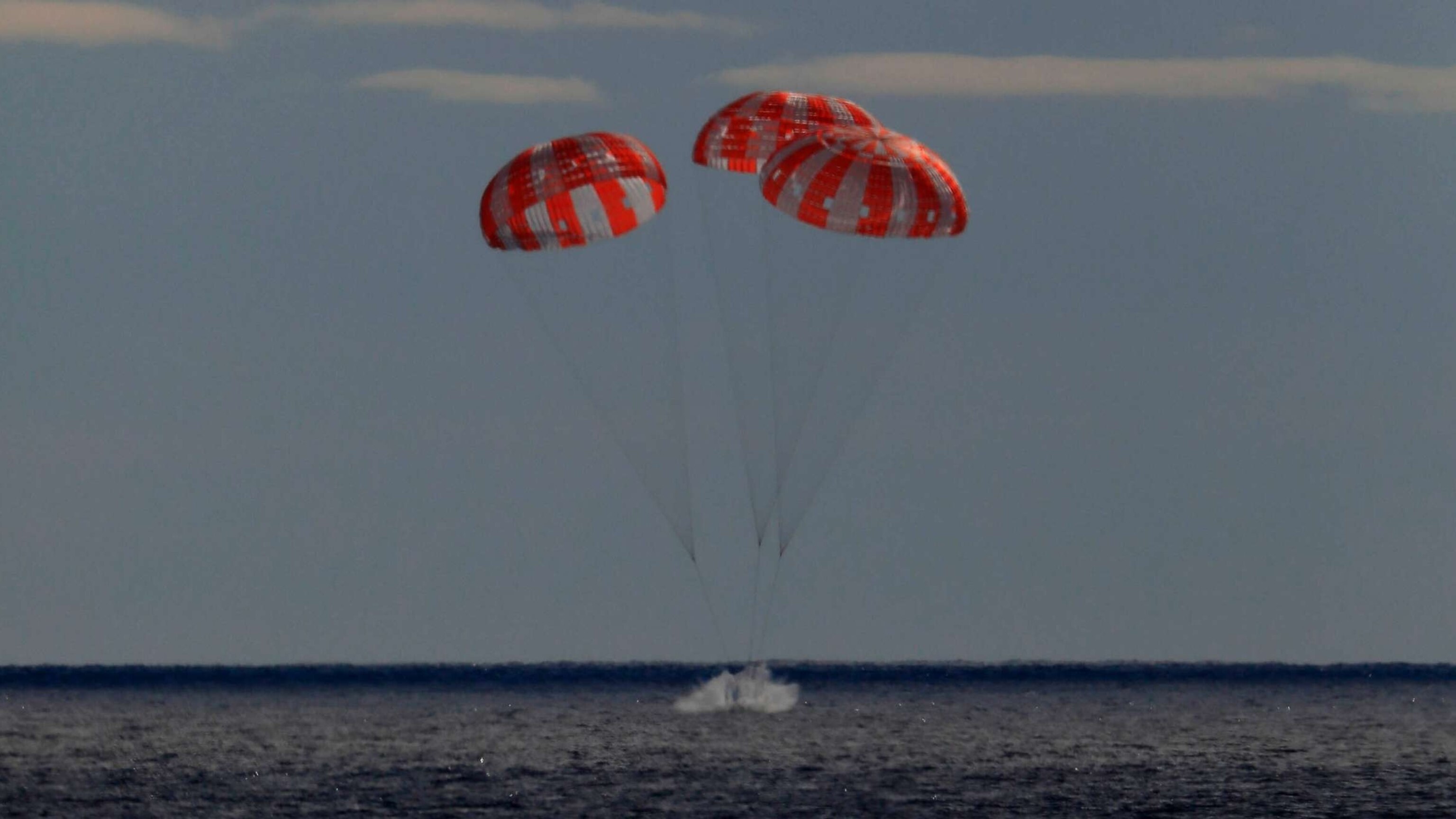 PHOTO: In this photo provided by NASA the Orion spacecraft for the Artemis I mission splashes down in the Pacific Ocean after a 25.5 day mission to the Moon, Dec. 11, 2022.