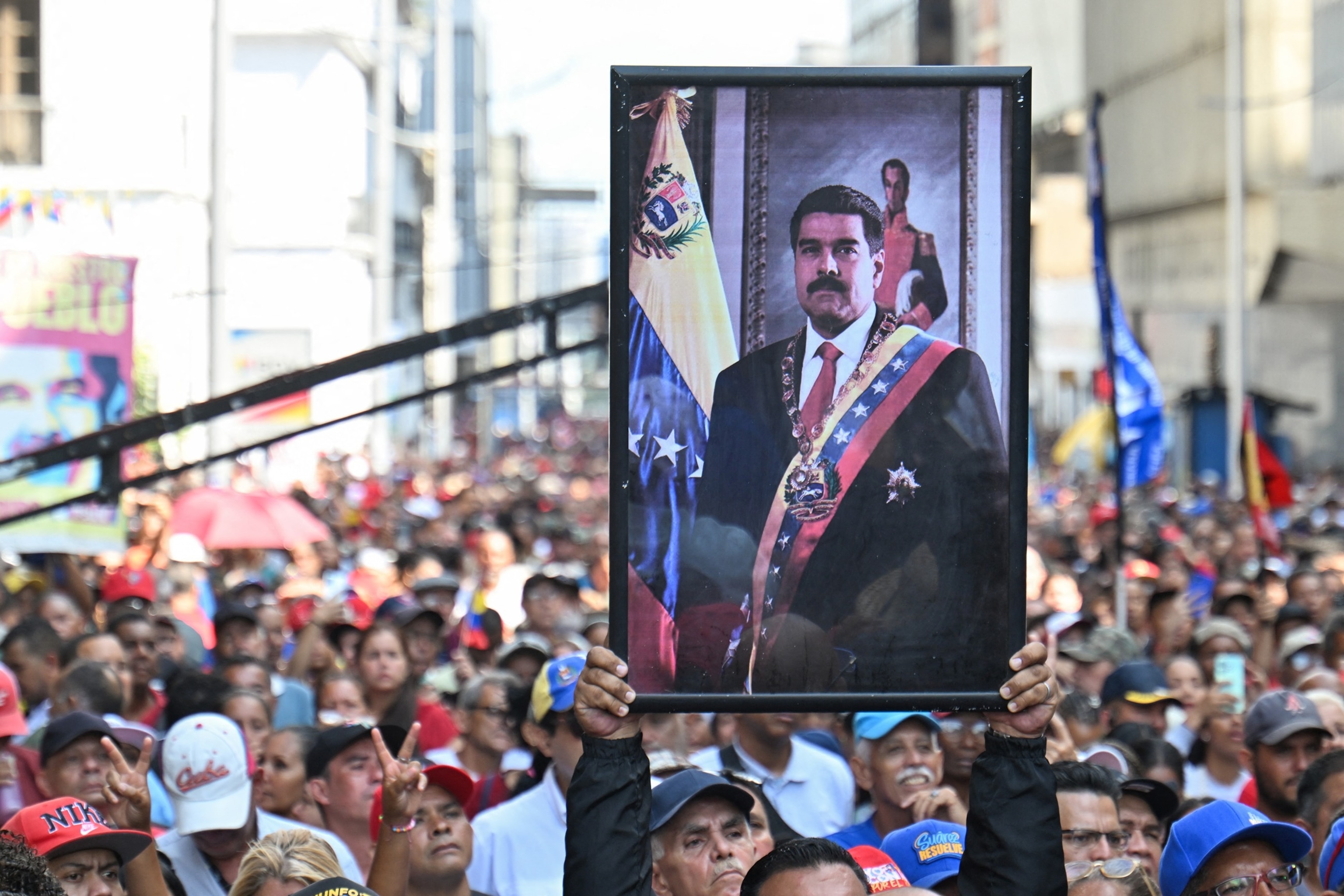 PHOTO: A demonstrator carries a portrait of deposed Venezuelan President Nicolas Maduro during a march outside the National Assembly in Caracas, Jan. 5, 2026.