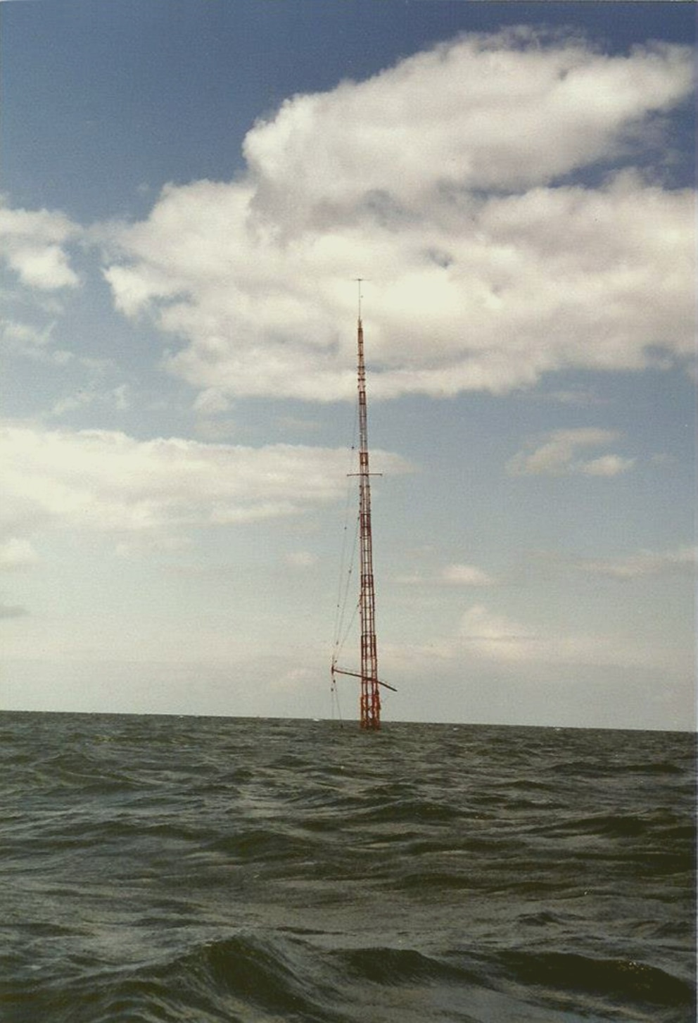 PHOTO: Caroline Mi Amigo Mast.  Caroline Mast sticking out the water in the North Sea after sinking in 1980. 