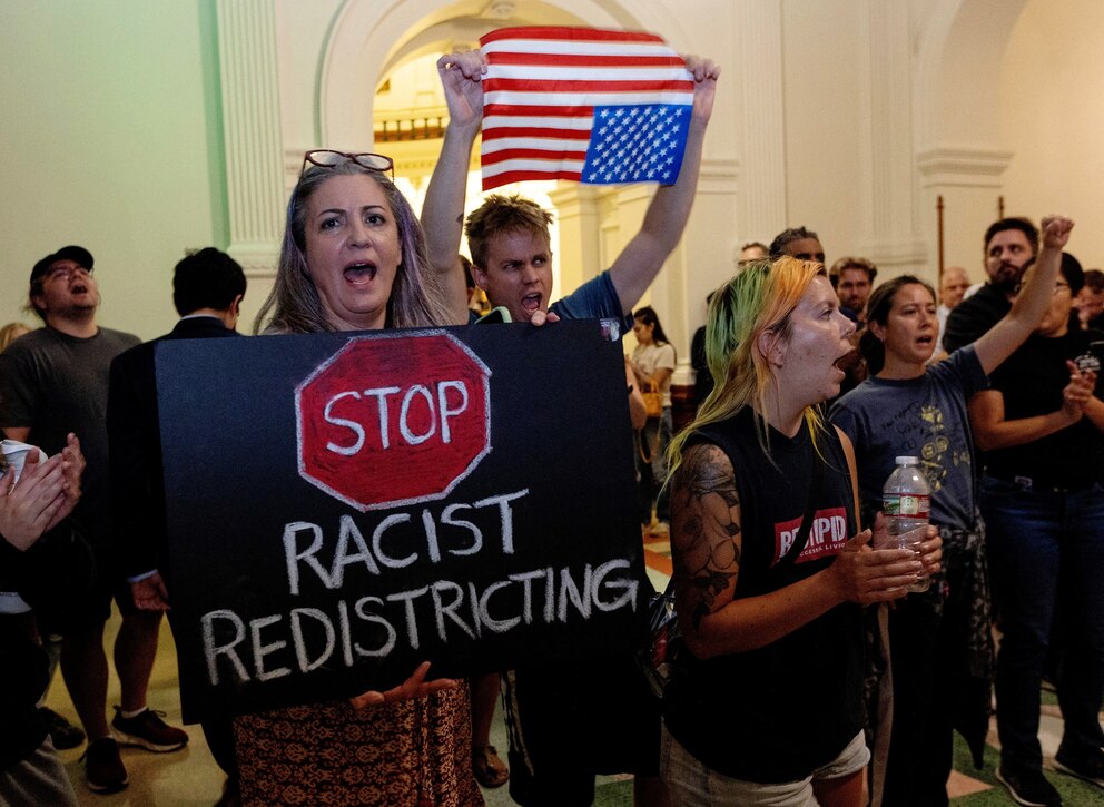 PHOTO: Protesters cheer on Texas State Representative Nicole Collier after she chose to remain in the Texas House chamber in Austin, Texas, August 18, 2025.