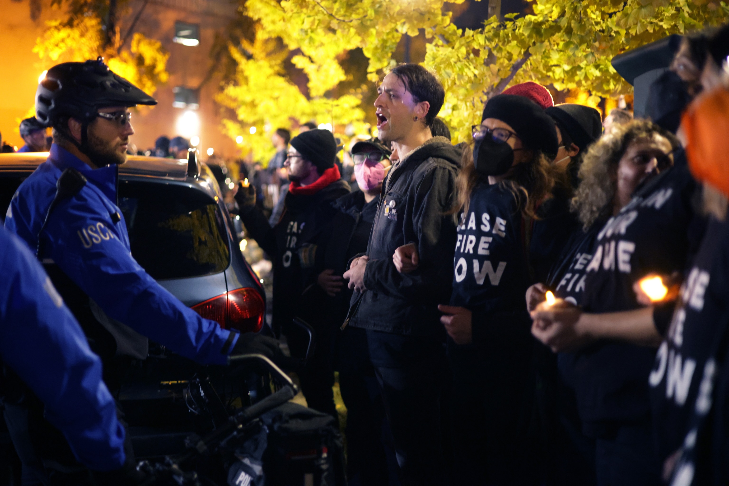 PHOTO: Members of U.S. Capitol Police and protesters stand off outside the headquarters of the Democratic National Committee during a demonstration on Nov. 15, 2023 on Capitol Hill in Washington, DC.