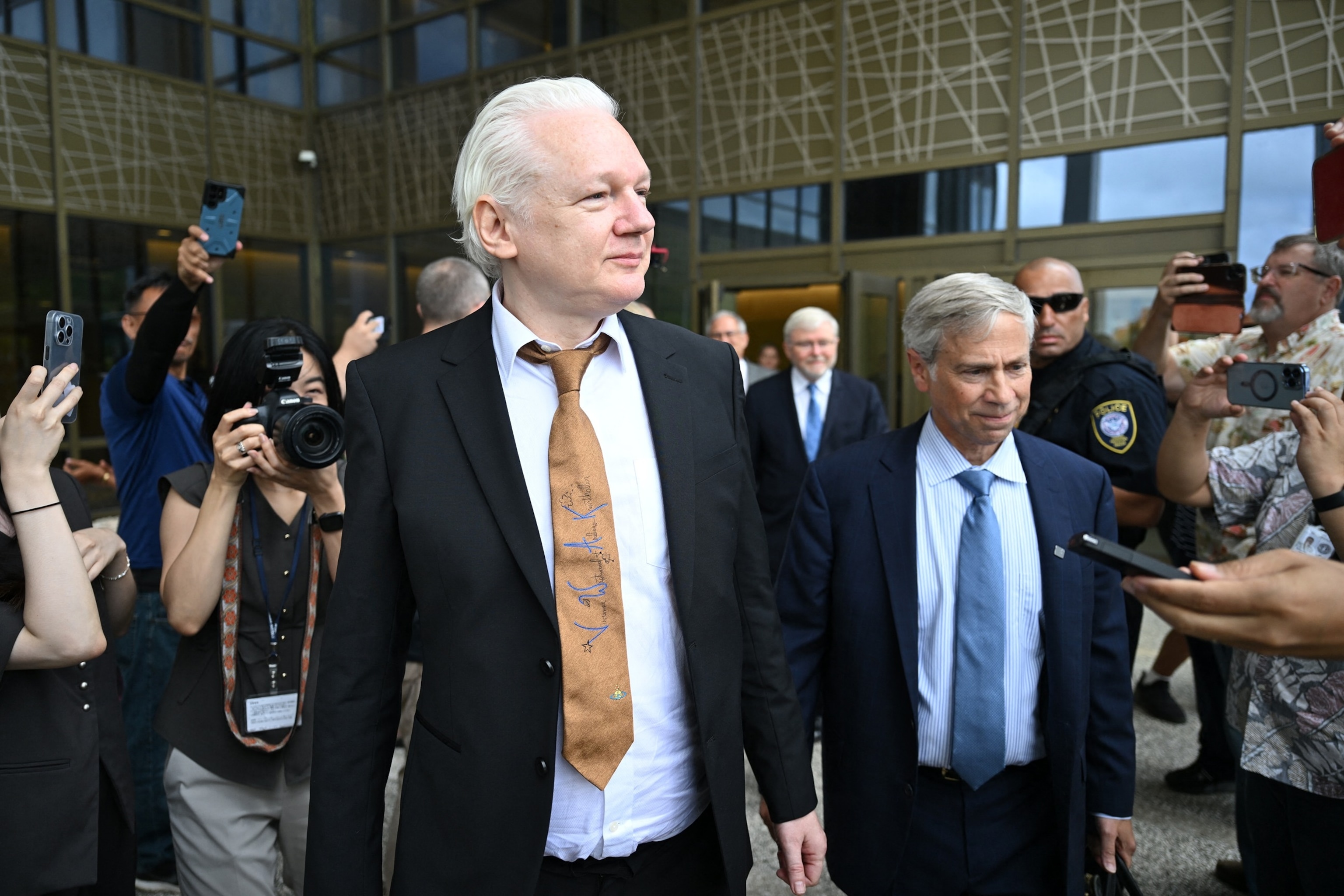 PHOTO: WikiLeaks founder Julian Assange (L) and his lawyer Barry Pollack leave the U.S. Federal Courthouse in the Commonwealth of the Northern Mariana Islands in Saipan, Northern Mariana Islands, June 26, 2024.