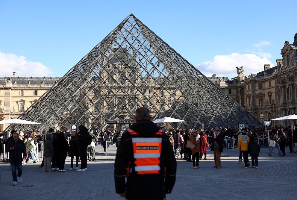 PHOTO: A member of security stands outside the Louvre Museum after French police arrested suspects in the Louvre heist case, in Paris, France, Oct. 26, 2025. 