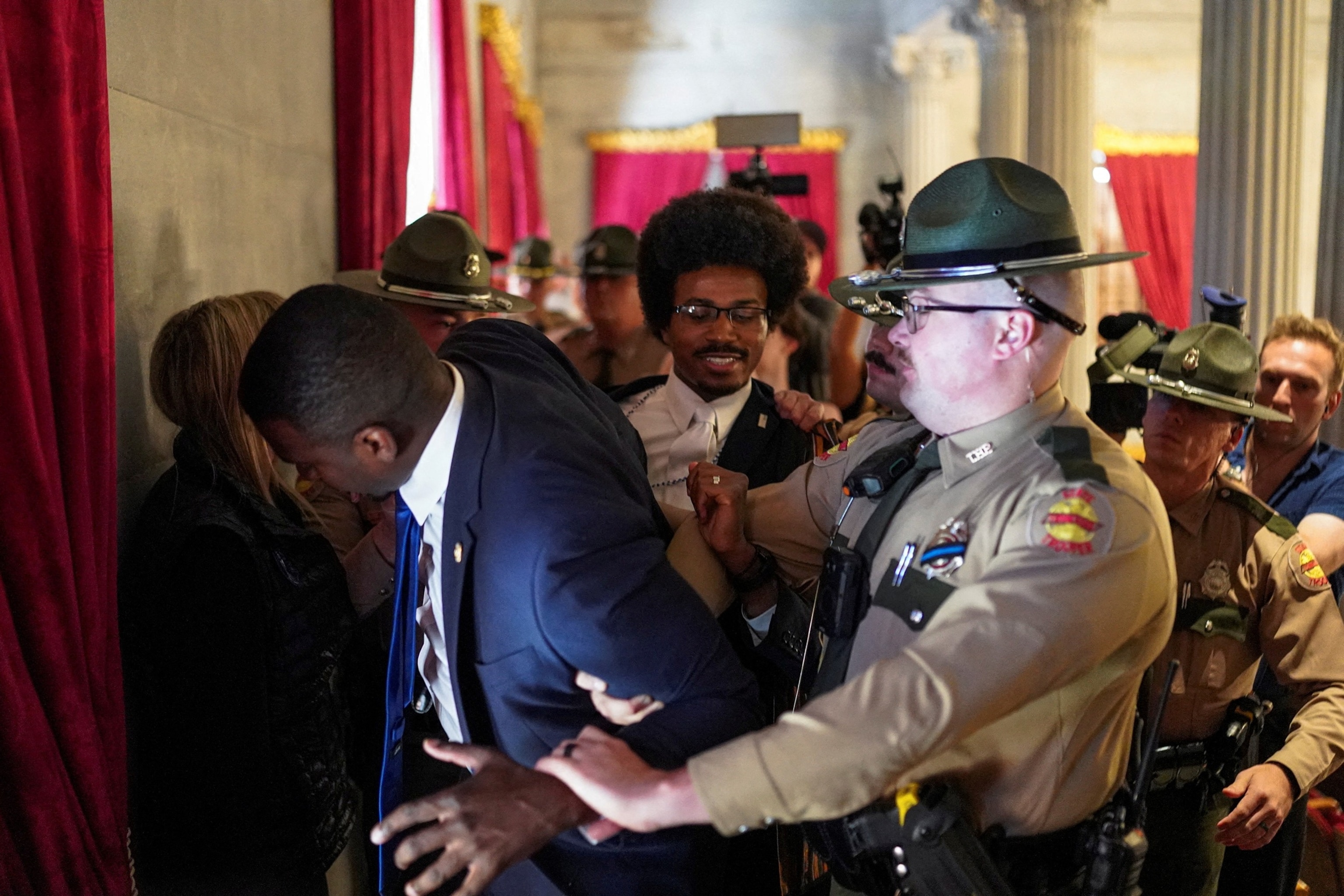 PHOTO: Democratic state representative Justin J. Pearson and his brother KeShaun Pearson are removed from the gallery after taking part in a silent sit-in protest on the last day of a special session in Nashville, Tennessee, May 7, 2026. 