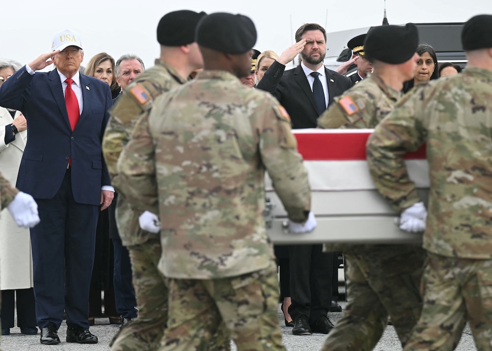 PHOTO: President Donald Trump and Vice President JD Vance salute as members of an Army team carry the flagged-drapped transfer case of soldier Maj. Jeffery R. O' Brien during a dignified transfer at Dover Air Force Base, in Dover, Delaware, Mar. 7, 2026.
