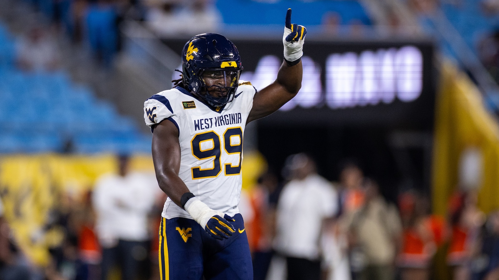 West Virginia beats No. 25 Virginia 38-27 in the Duke’s Mayo Classic