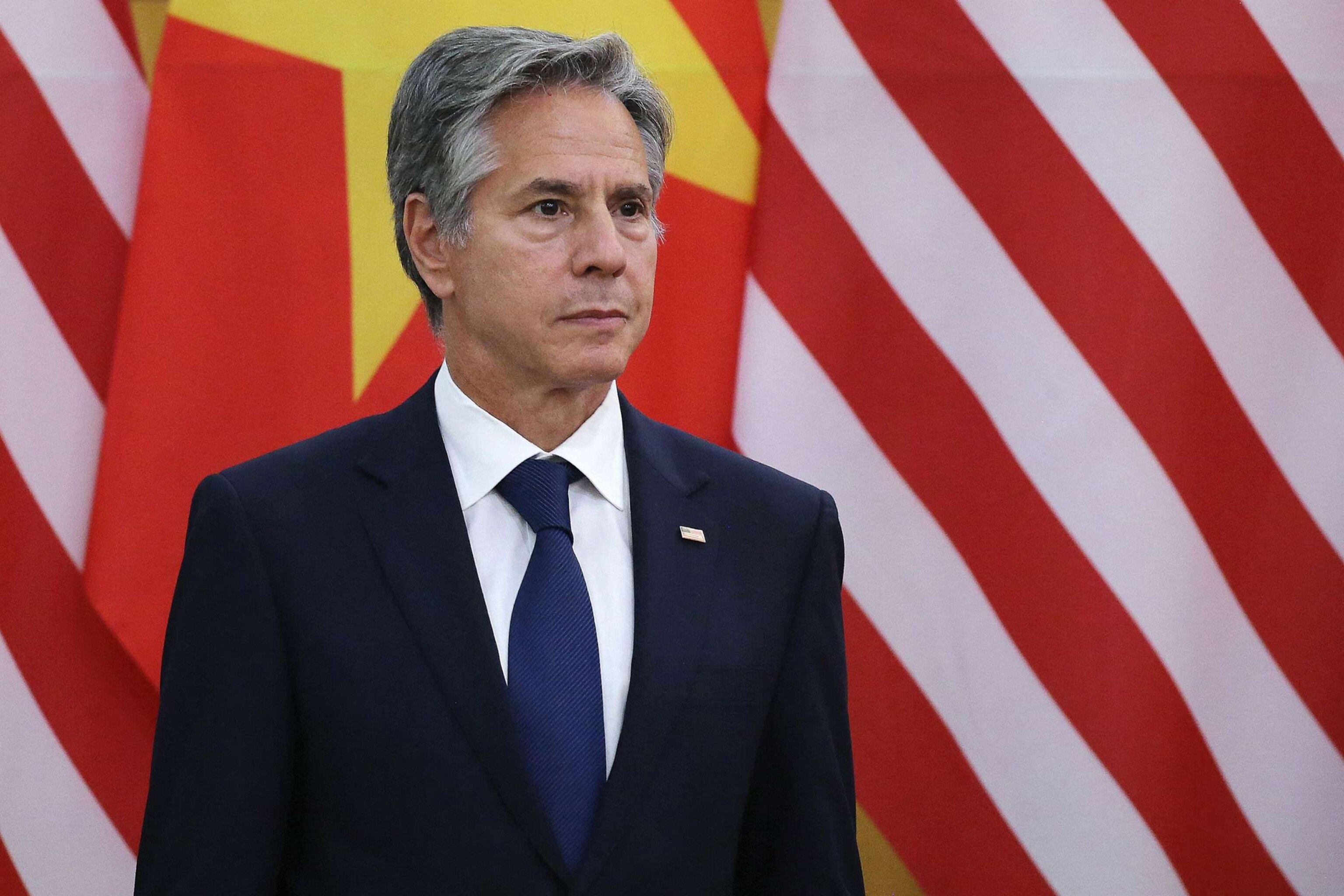 PHOTO: Secretary of State Antony Blinken listens as President Joe Biden and Vietnam's Communist Party General Secretary Nguyen Phu Trong speak to the media after a meeting at the Communist Party of Vietnam Headquarters in Hanoi, Sept. 10, 2023.