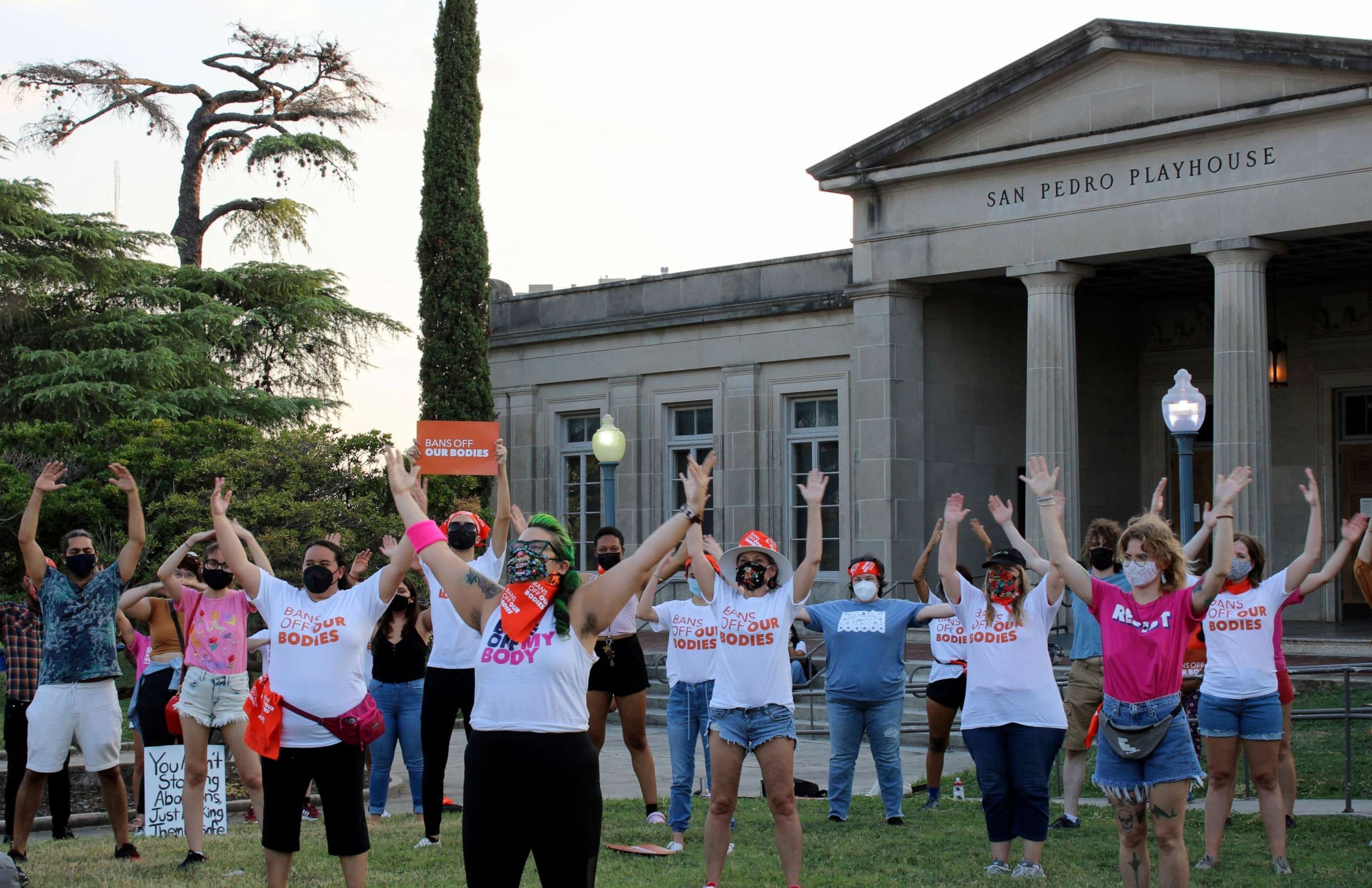 PHOTO: People participate in "Bans Off Our Bodies!", a performance protest in front of the San Pedro Playhouse in San Antonio, Texas, Sept. 1, 2021.