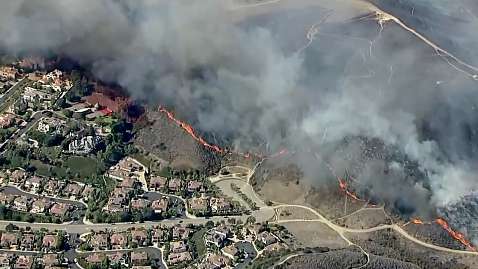 Evacuation orders issued as wildfire burns in Orange County, California