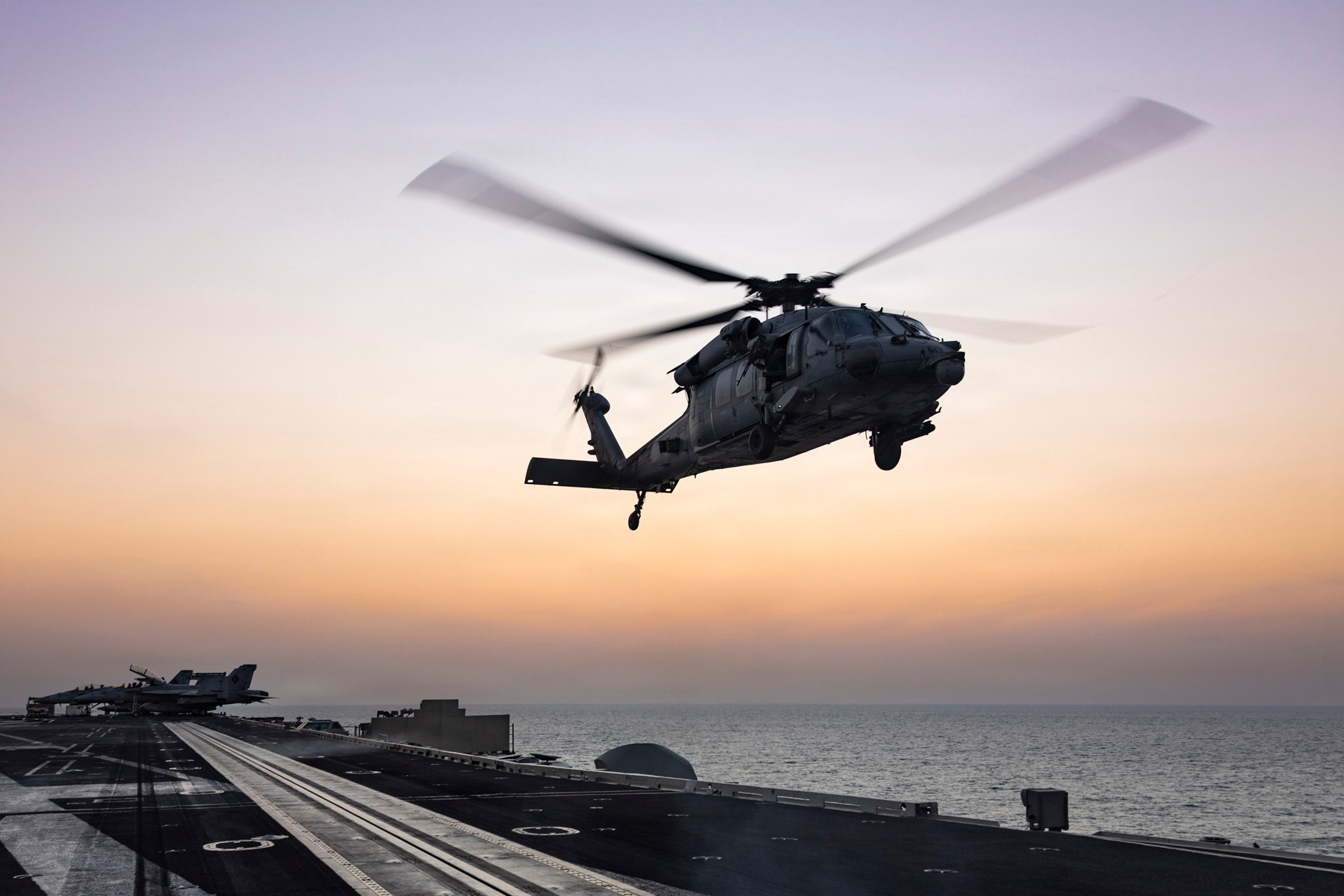 PHOTO: An MH-60S Sea Hawk helicopter, attached to Helicopter Sea Combat Squadron 14, lands on the flight deck of Nimitz-class aircraft carrier USS Abraham Lincoln  in support of Operation Epic Fury, March. 4, 2026. 