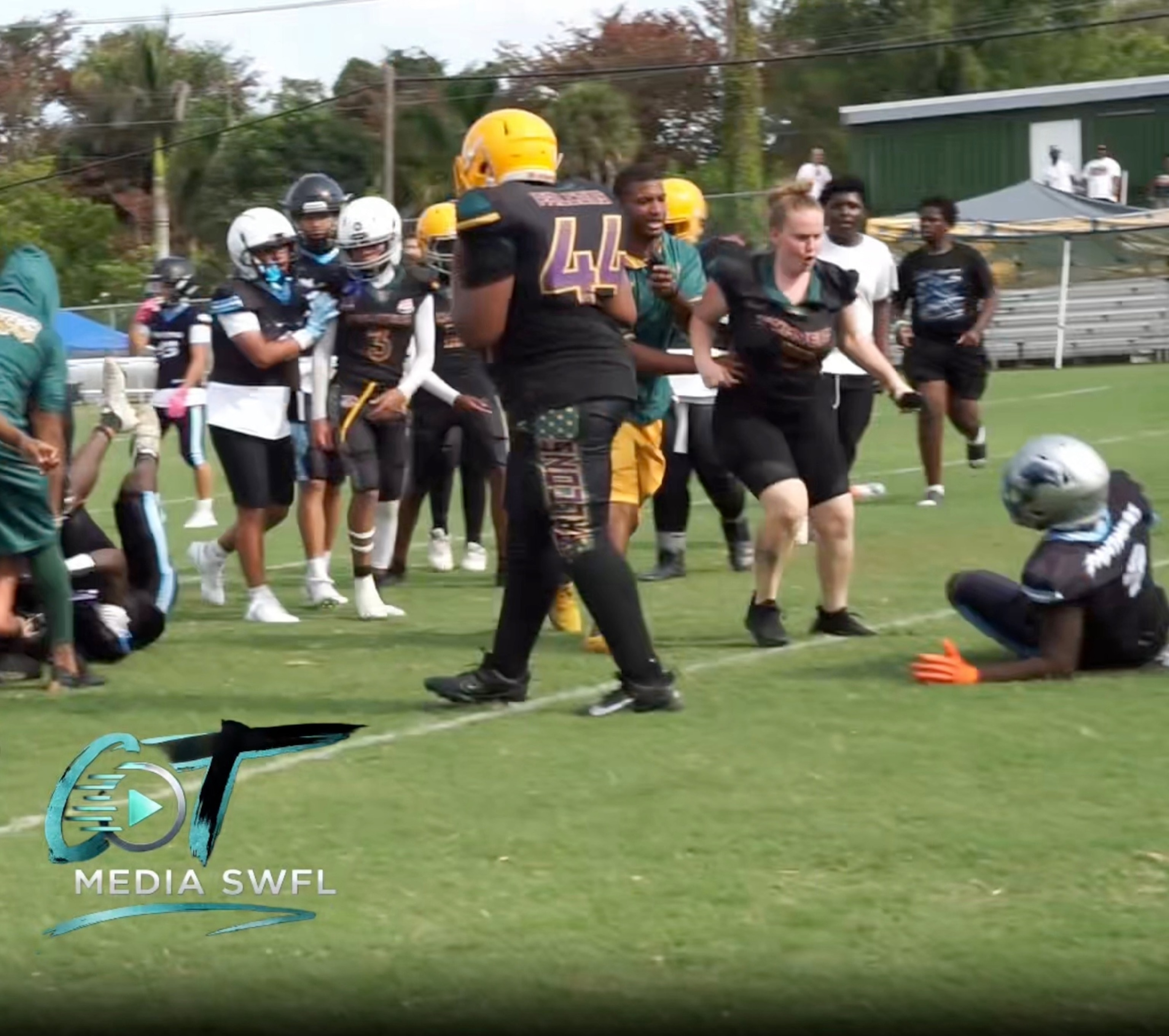 PHOTO: Video captured the moment a woman rushed onto a football field in Fort Myers, Florida, and allegedly assaulted a child after a fight broke out between players at a Pop Warner football game, May 2, 2026, according to police