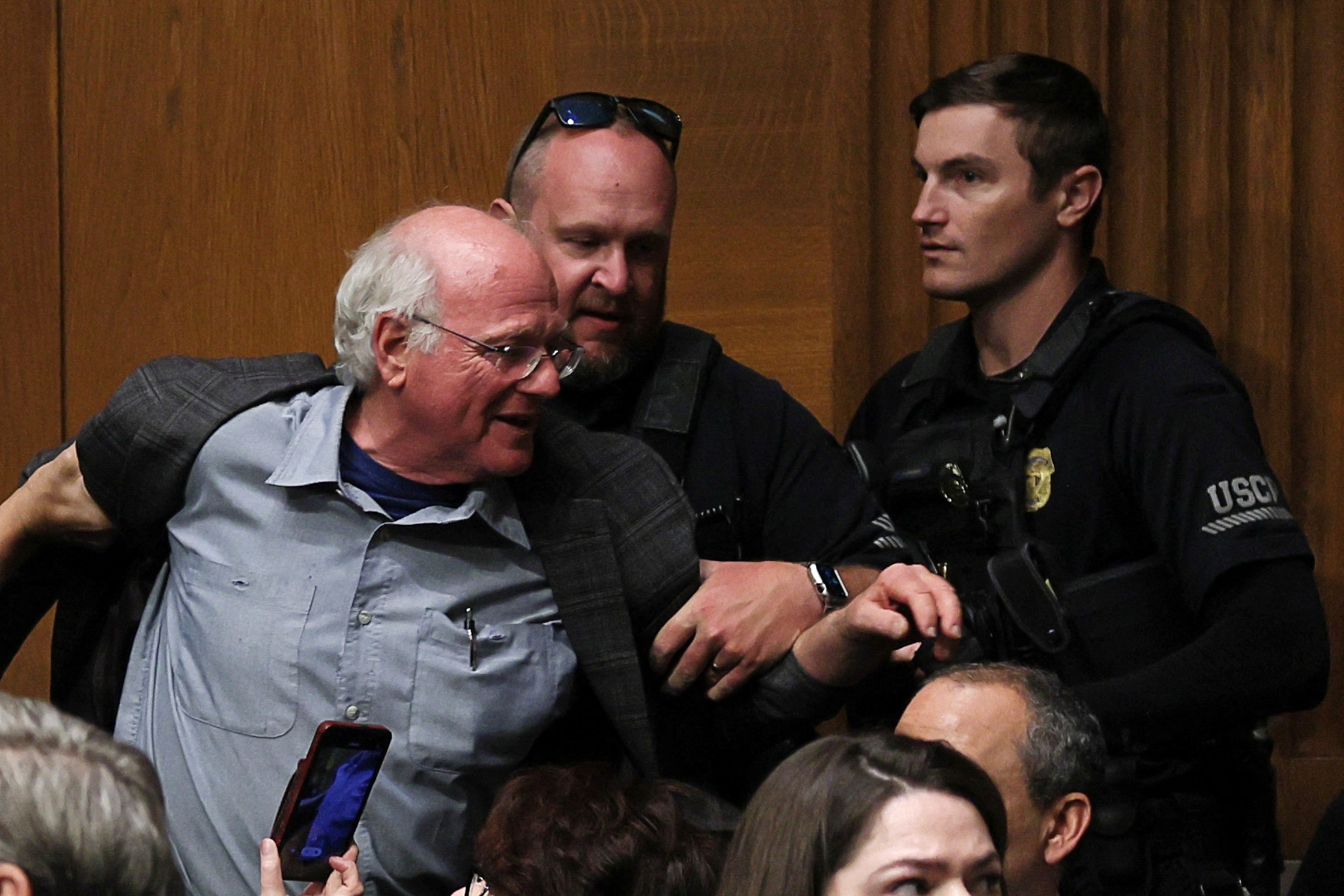 PHOTO: Ben Cohen, co-founder of ice cream company Ben & Jerry's, is removed by U.S. Capitol Police as U.S. Health and Human Services (HHS) Secretary Robert F. Kennedy Jr. testifies on Capitol Hill in Washington, D.C., May 14, 2025.