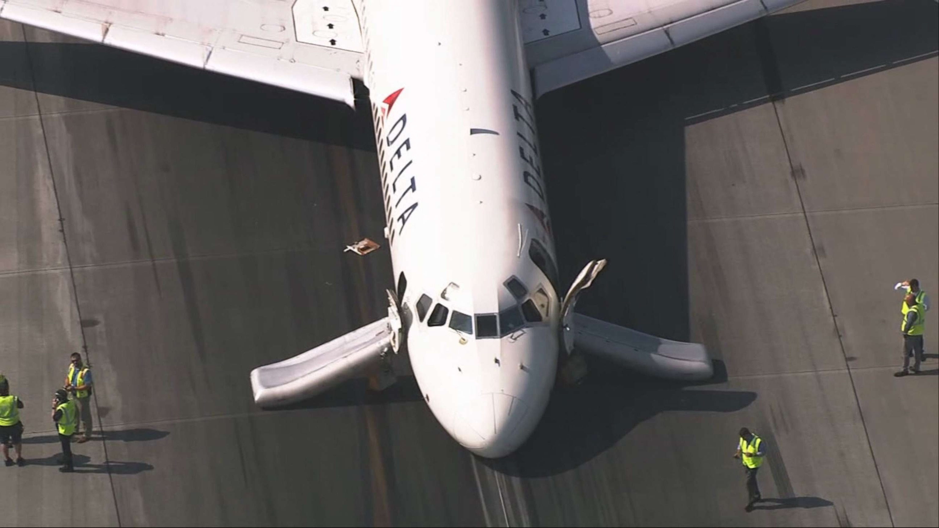 PHOTO: A plane that landed at Charlotte Douglas International Airport in N.C. without its landing gear extended, sits on the runway, June 28, 2023.