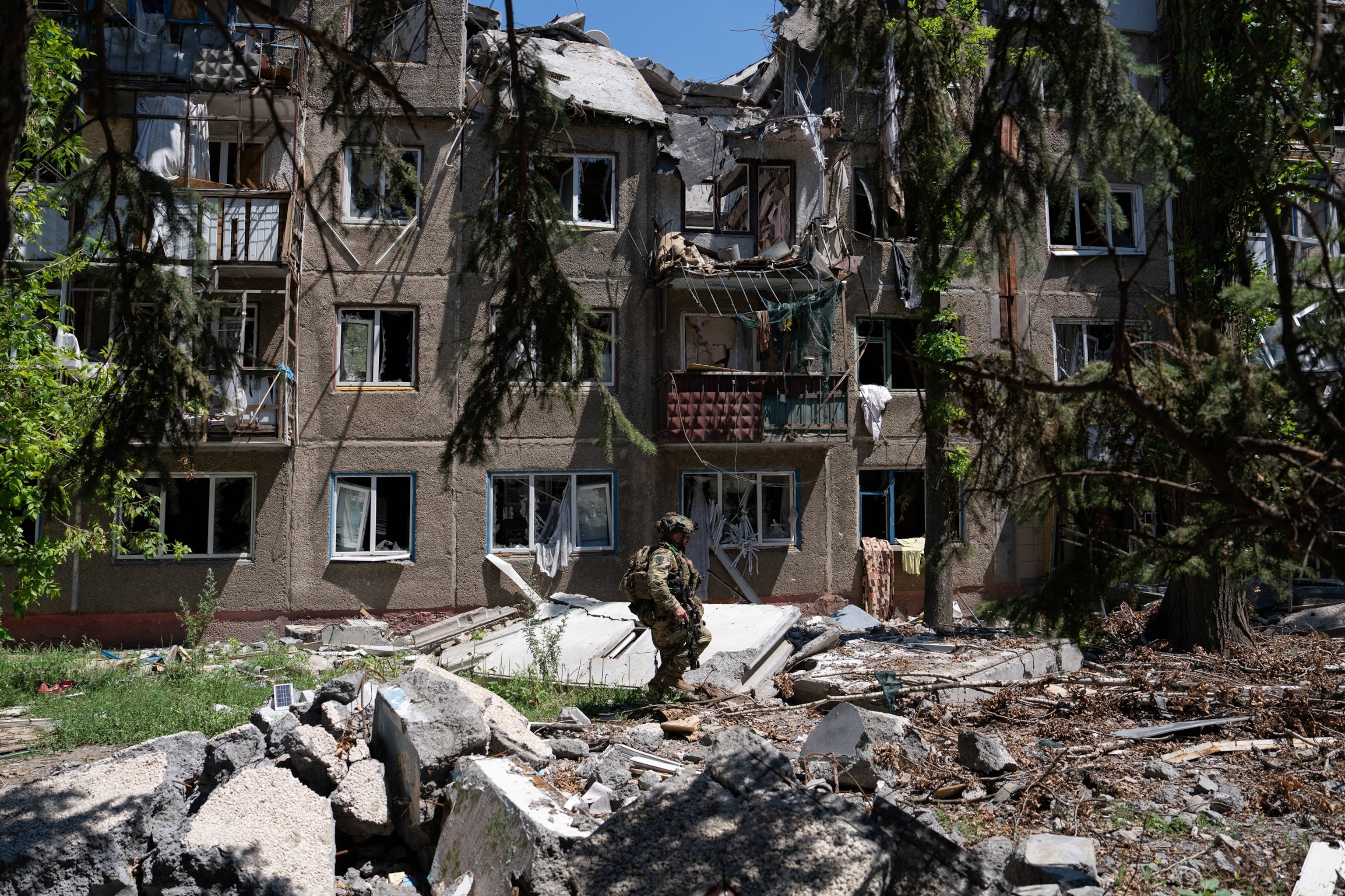 PHOTO: In this handout photograph released on July 3, 2026, by the press service of the 93rd Kholodnyi Yar Separate Mechanized Brigade of the Ukrainian Ground Forces, a soldier patrols in the frontline town of Druzhkivka, in the Donetsk region.
