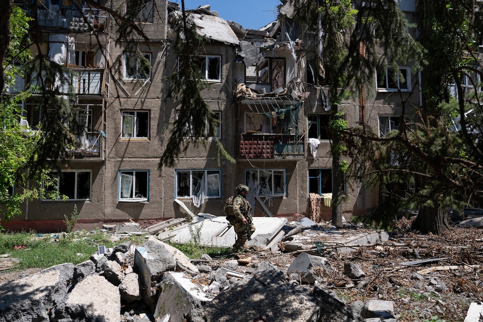 PHOTO: In this handout photograph released on July 3, 2026, by the press service of the 93rd Kholodnyi Yar Separate Mechanized Brigade of the Ukrainian Ground Forces, a soldier patrols in the frontline town of Druzhkivka, in the Donetsk region.