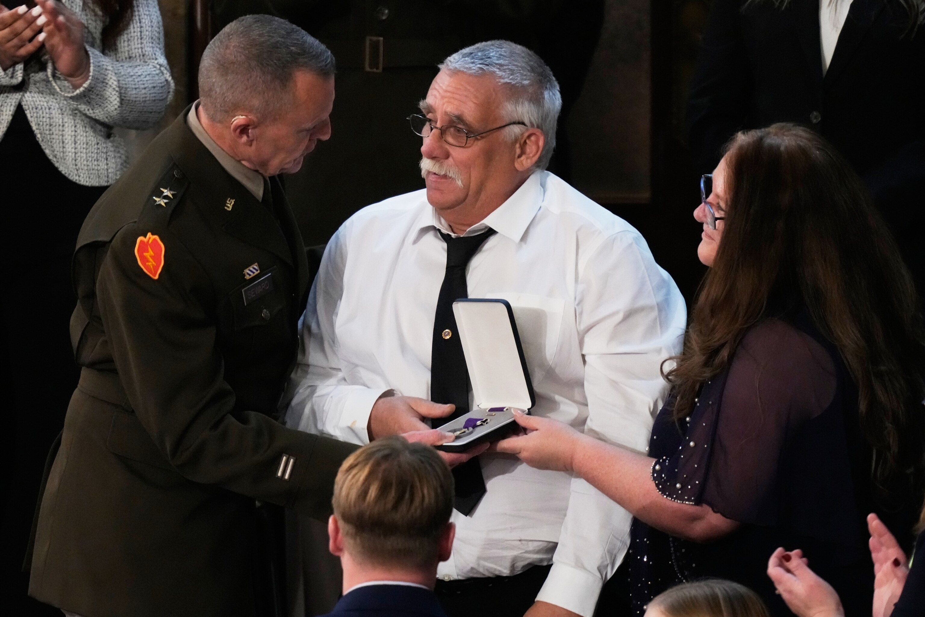 PHOTO: Evalea and Gary Beckstrom receive a Purple Heart on behalf of their daughter during President Donald Trump's State of the Union address to a joint session of Congress in the House chamber at the U.S. Capitol in Washington, D.C., Feb. 24, 2026.